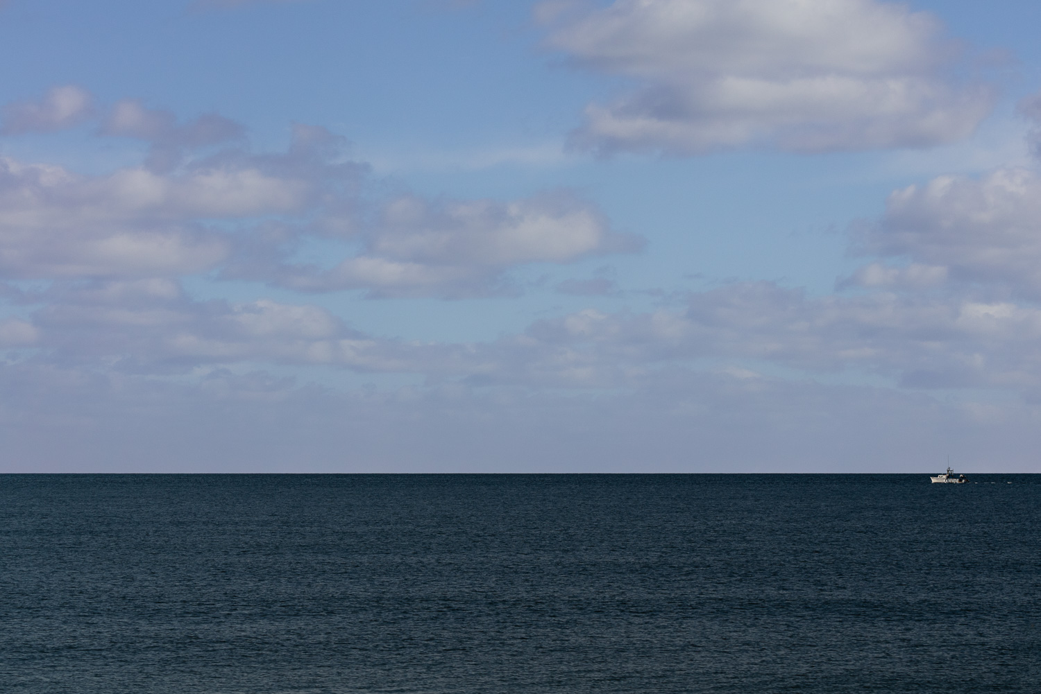  solitary boat on horizon 