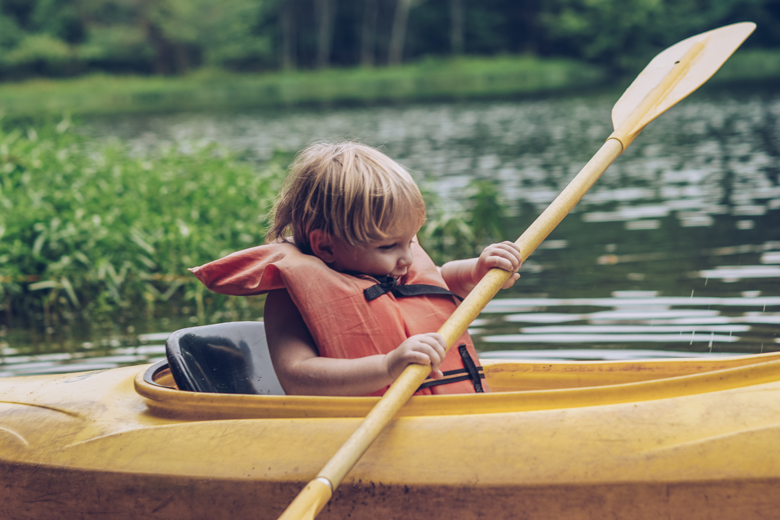 I don't see any problems with tiny Taters paddling a kayak in his oversized life vest