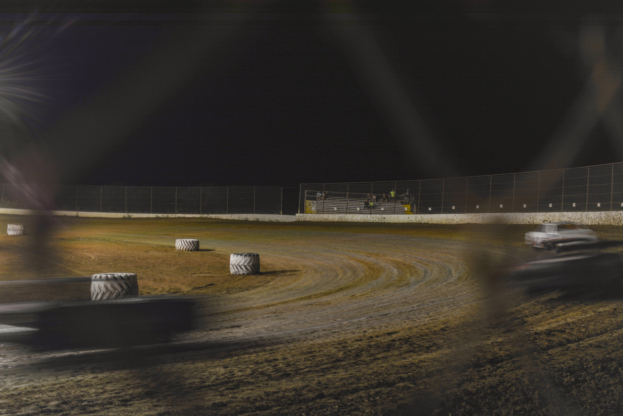 View of cars banking around the track