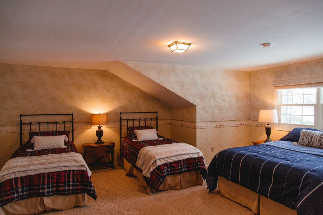 Queen bed + twin beds, second floor.