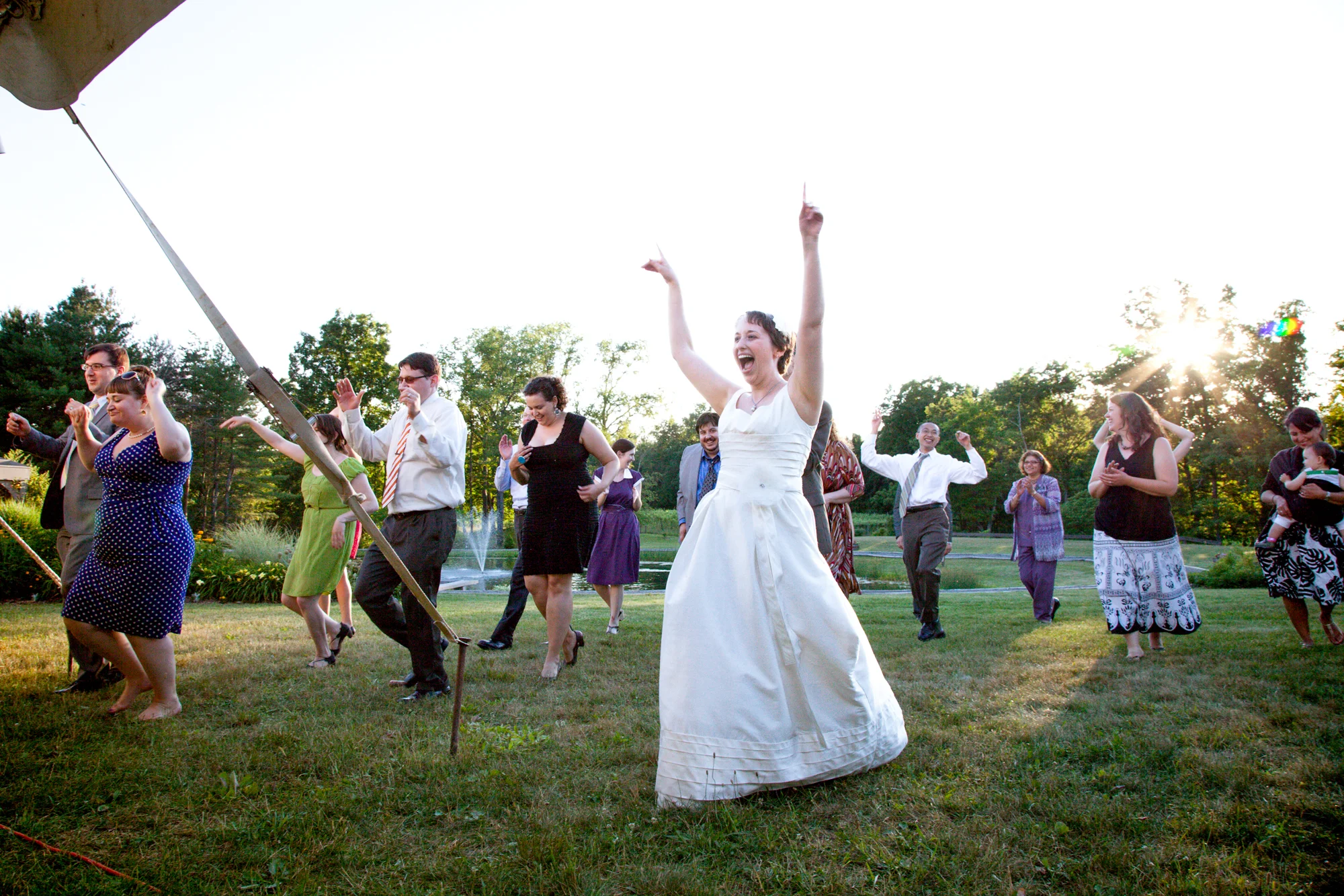 133_CarlyGaebe_SteadfastStudio_WeddingPhotography_NewYork_Ithaca_Winery_SixMileCreekVineyard_BridalParty_Bride_Outside_Fun_Reception.jpg