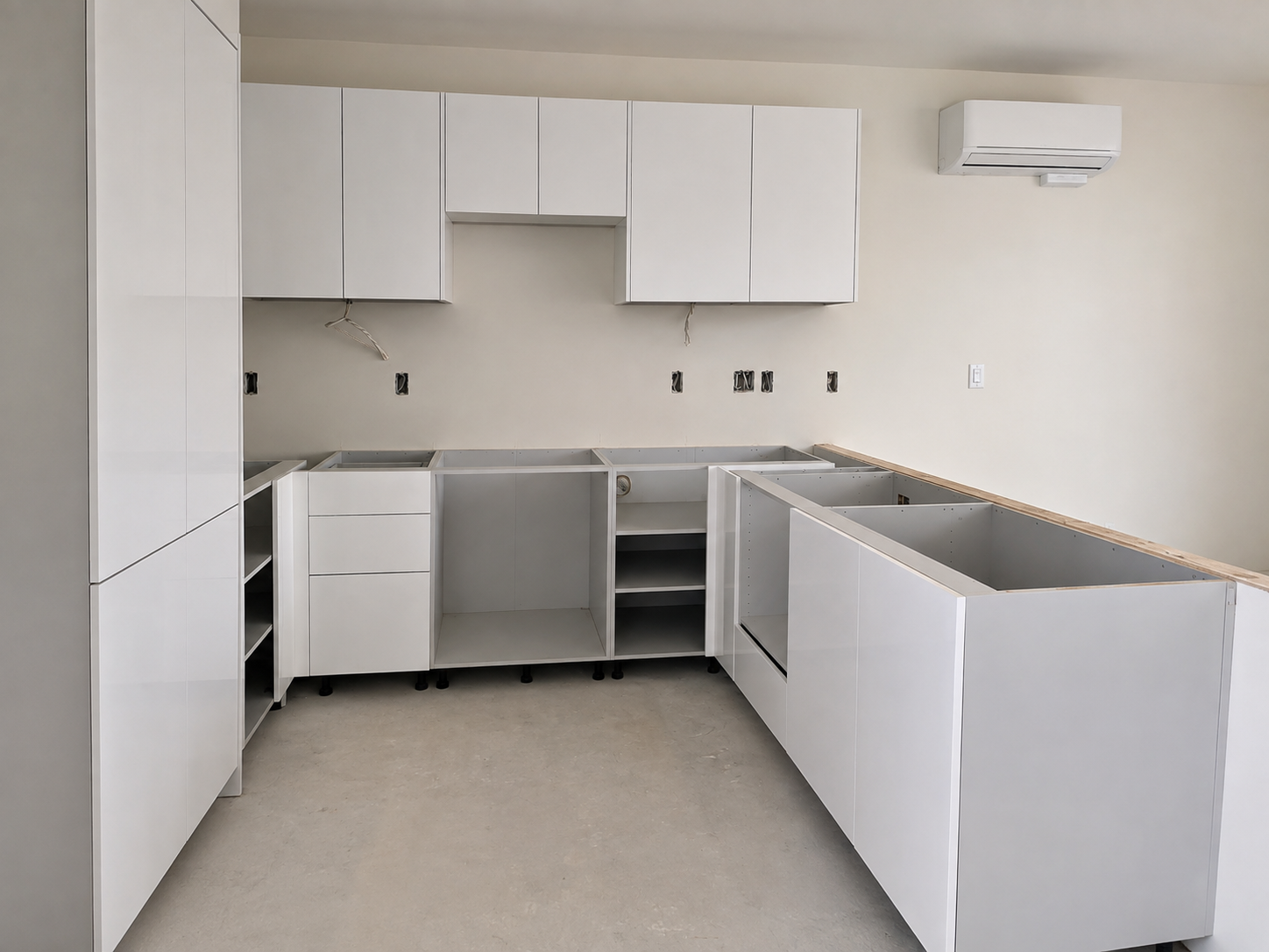 Cabinetry installation in progress at the Cantera development before countertops, appliances, and final finishing.