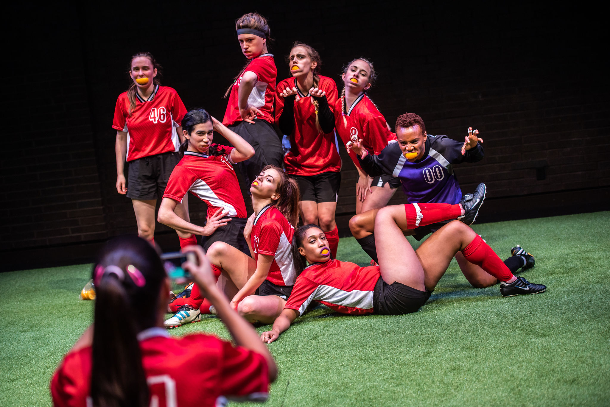 The Wolves - Photo by Dahlia Katz Starring : Rachel Cairns, Aisha Evelyna, Ruth Goodwin, Annelise Hawrylak, Ula Jurecka, Brittany Kay, Heath V. Salazar, Hallie Seline, Amaka Umeh and Robyn Stevan Set & Lighting Design by Jareth Li (Assistant: Scarlett Larry) Sound Design & Composition by Deanna H. Choi (Assistant: Cosette Pin) Costume Design & Movement Coaching by Sarah Doucet Stage Management by Sam Hale Assistant Stage Management by Hannah MacMillan Assistant Direction by Rebecca Gibian