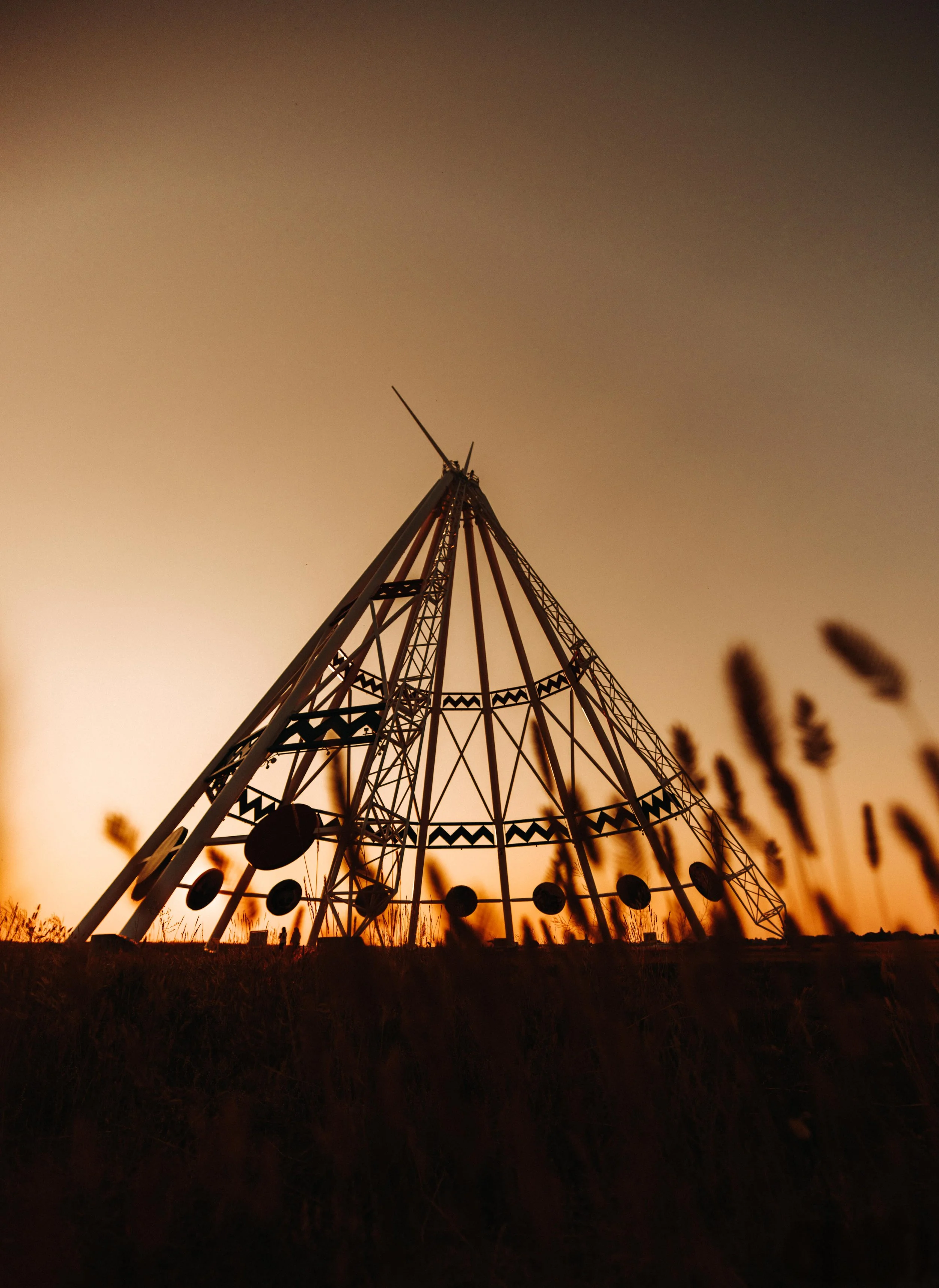 sunset behind tepee