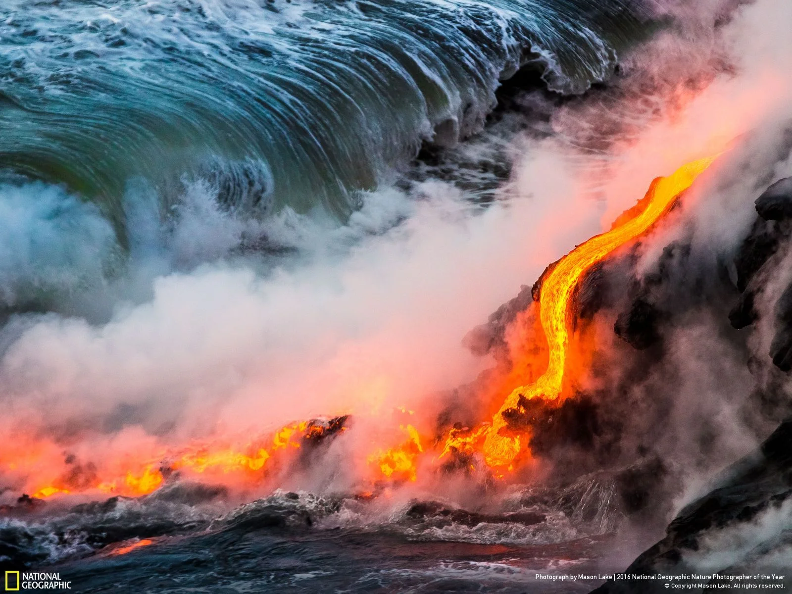 Lava Ocean Entry by Mason Lake: Lava ocean entry from the 2016 Kalapana lava flow on the Big Island of Hawaii. Watching new earth being formed is an amazing experience. Boiling ocean waves crashing into fresh lava & giving off clouds of steam along with scatter violent lava bursts from pressure release, creation of the earth is mesmerizing & powerful sight. Location: Hawaii