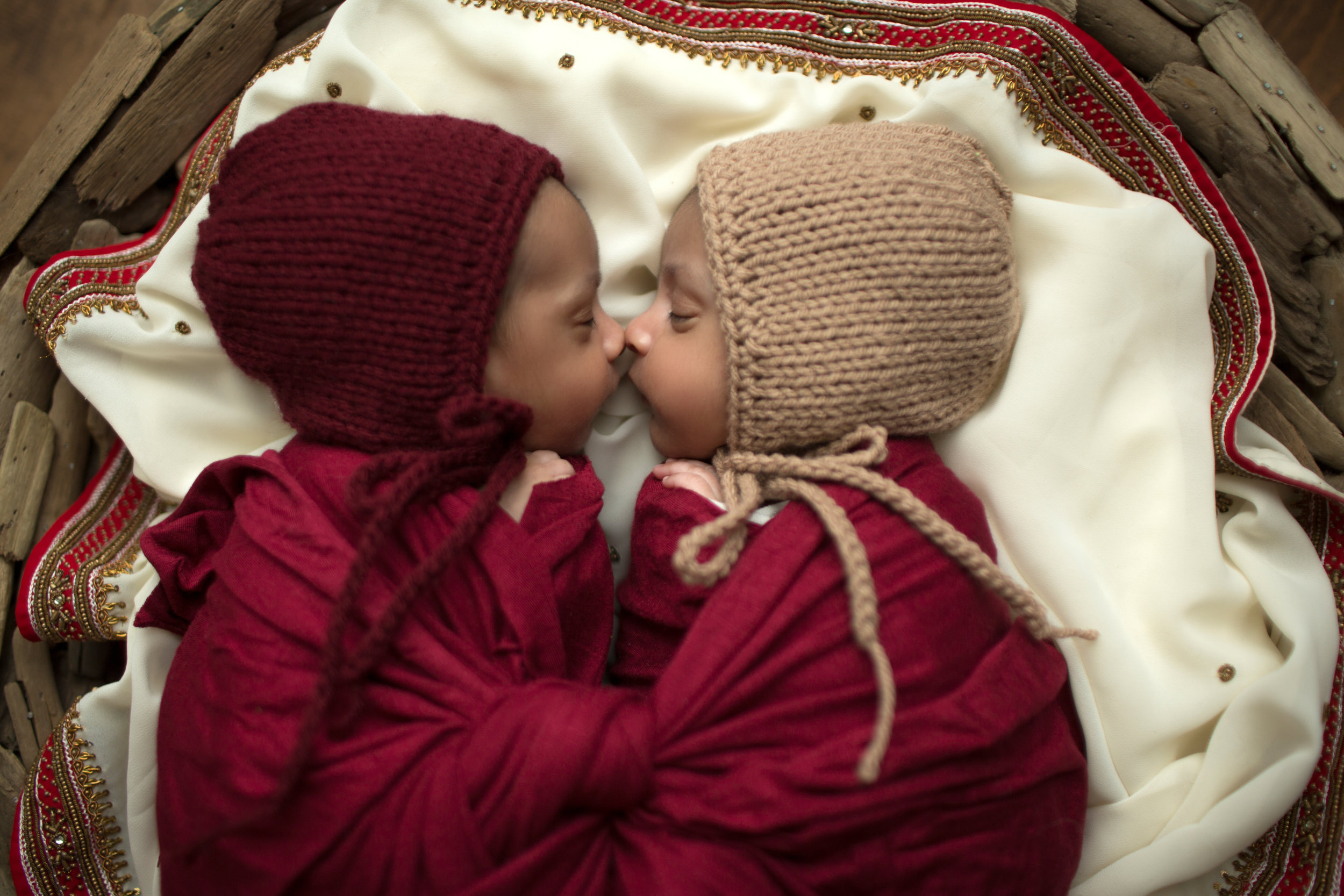 twin girls nose to nose photography