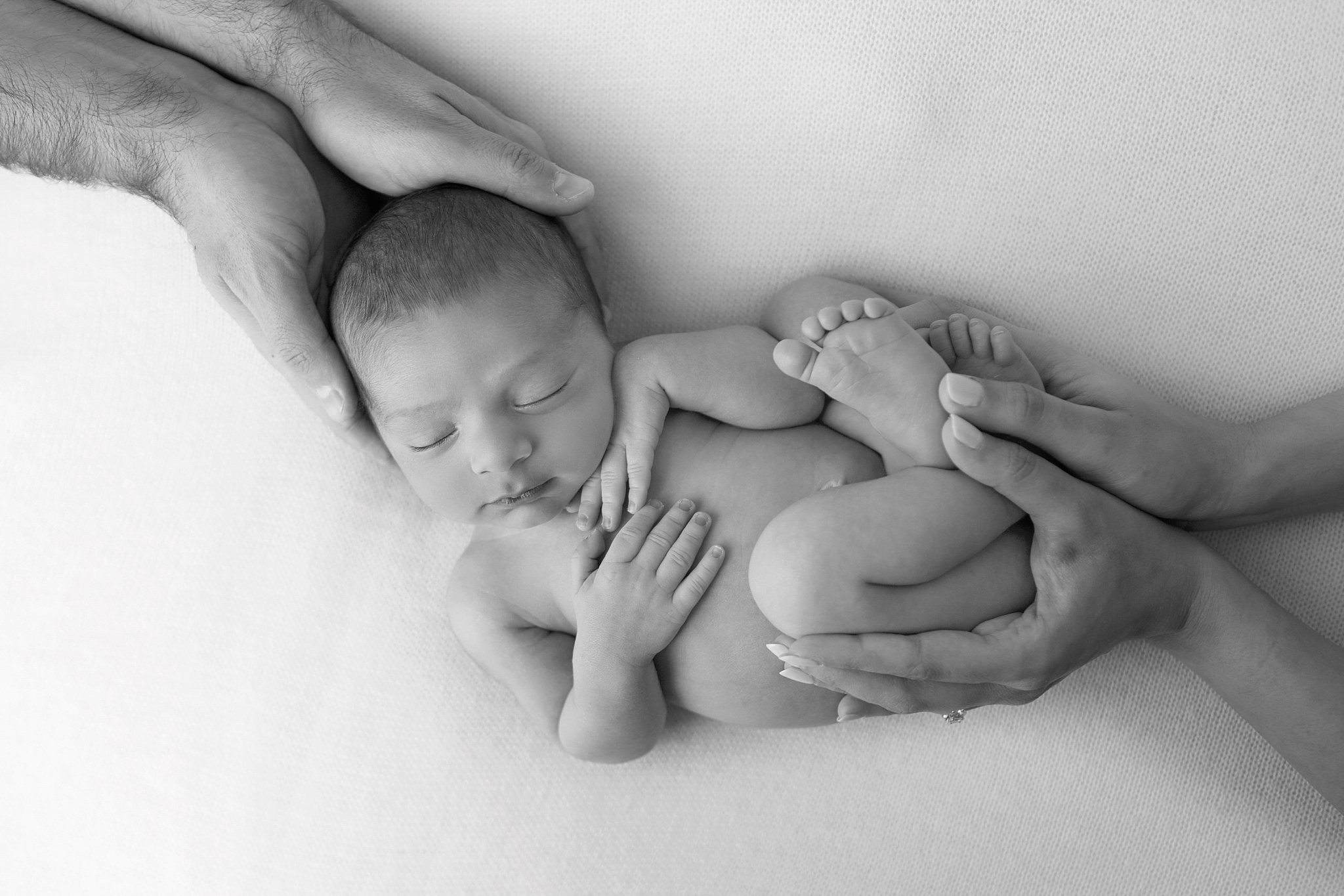 newborn in parents arms