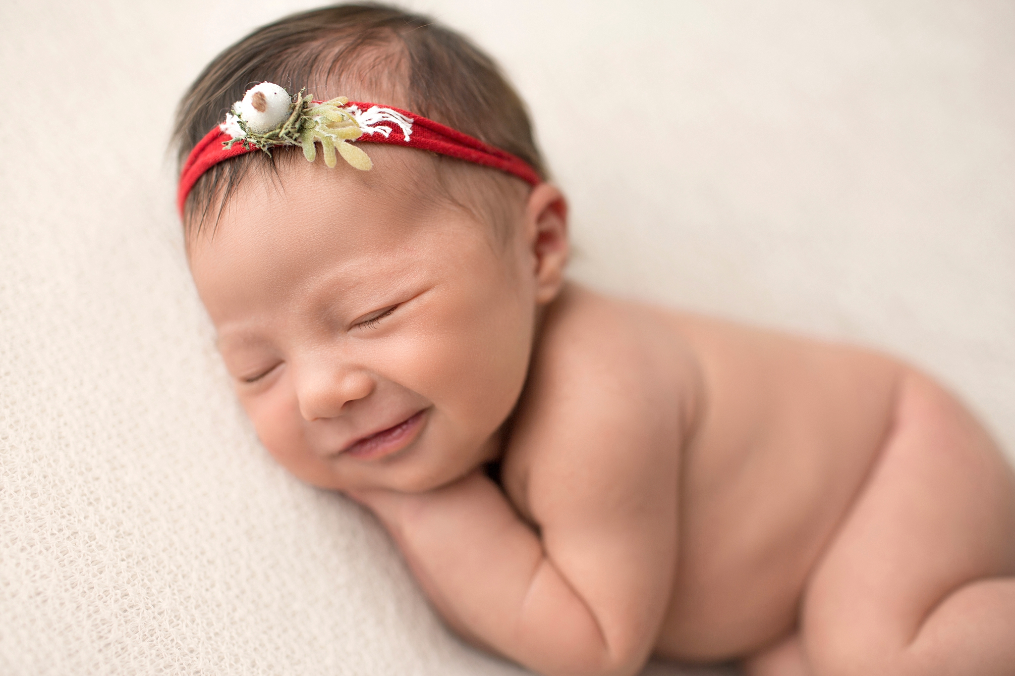 baby with red headband