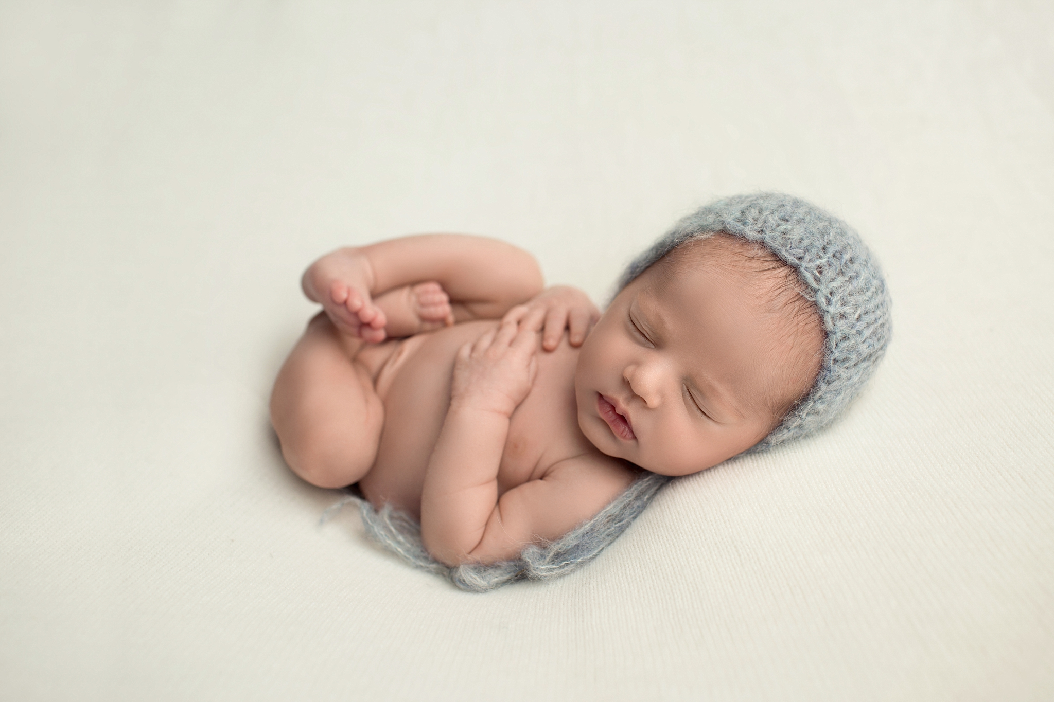 baby with grey hat