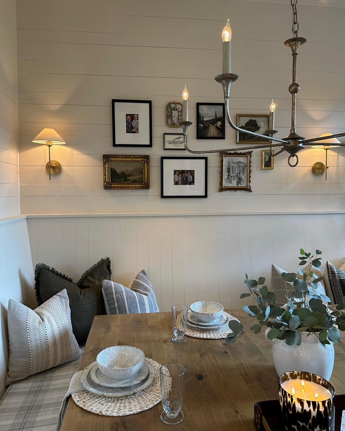 Rainy day dinner at our English Farmhouse Project ✨

This custom banquette, sconces, collected photos, and beautiful table scape make for the most inviting spot to sit and have a conversation over a meal! 

#truthandco #dinner #diningroom #custombanq