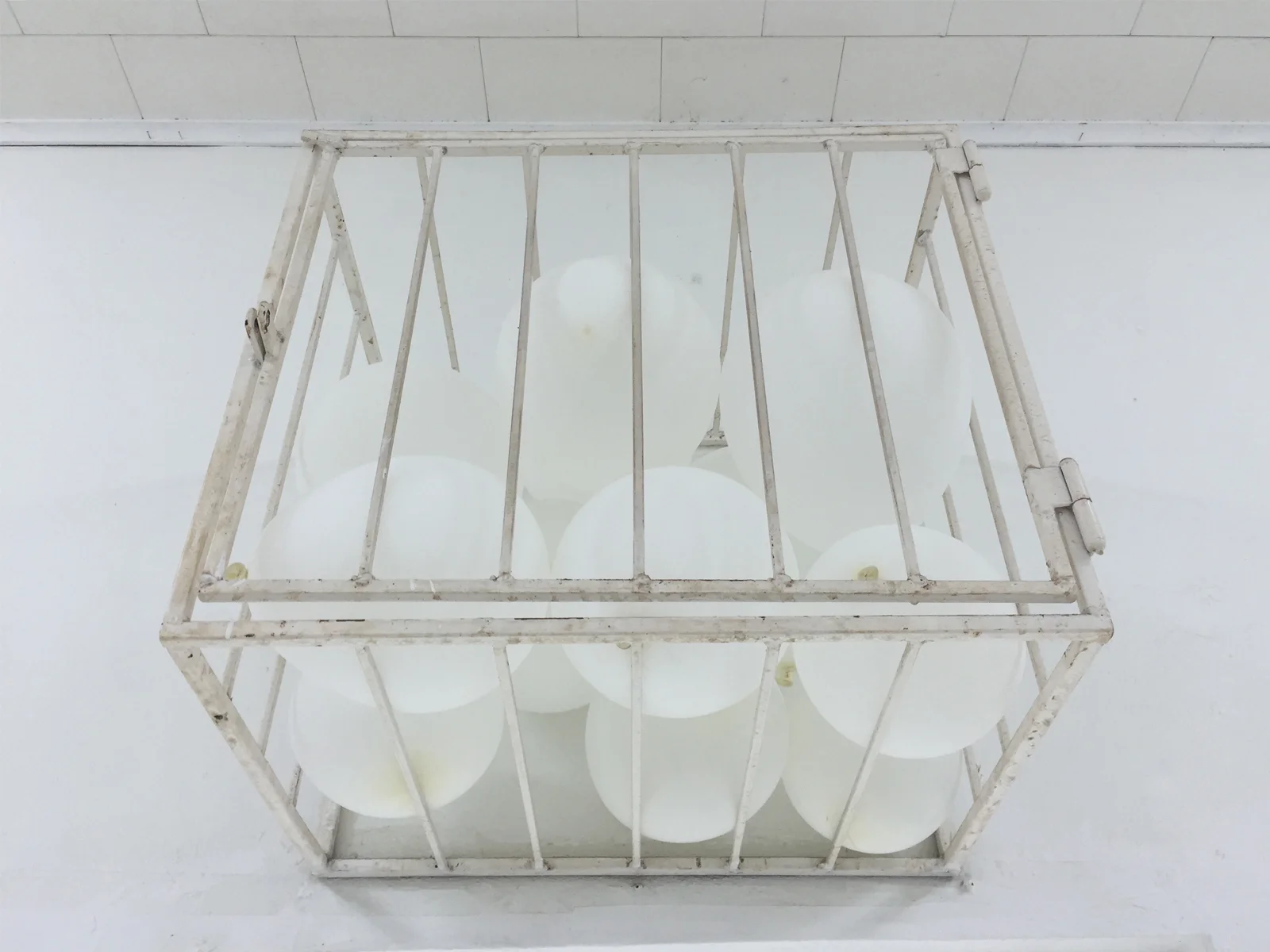 2016, 12 air balloons inside A/C unit security cage. Photo courtesy of Humberto Diaz.