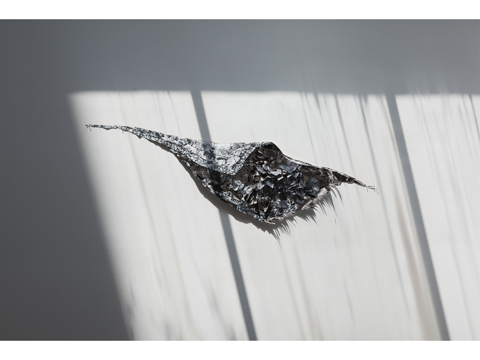 2015, 3.5 ft x 9.5 ft Wall installation + binoculars Sewn collage (paper, thread) Collage made of printed nano scale dust sample from San Juan (images courtesy of MS student Simge Uzun, Fiber Science Department, College of Human Ecology, Cornell University)
