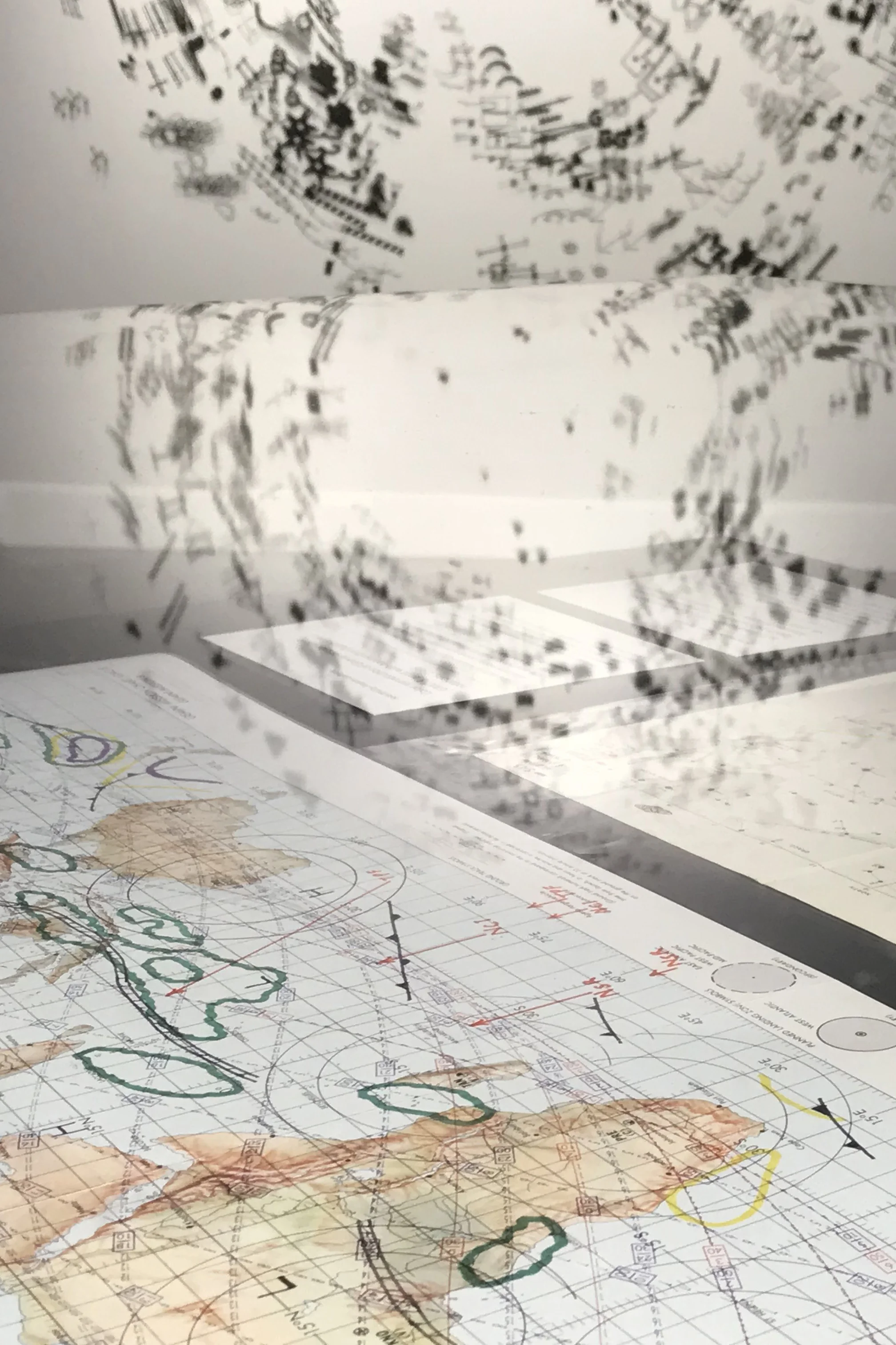 Top: Untitled (Purdue Archives), 2019, 7 ft diameter, laser-cut paper wall drawing, dressmaker pins. Bottom: Gemini mission chart (GMC) 8, Gemini Mission 8 , Weather forecast for 212. 3/16/66?, courtesy of Purdue Space Exploration Archives