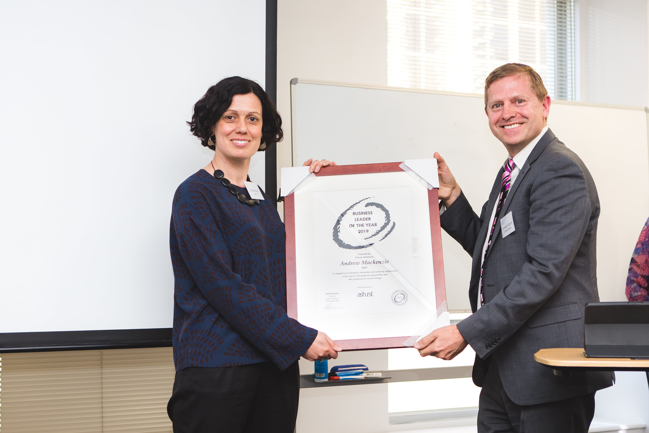  Leader of the Year Award winner Andrew MacKenzie (represented by Susie Wood), with Turlough Guerin, Chairman Climate Alliance Board of advisors. The award was sponsored by Ashurst. 