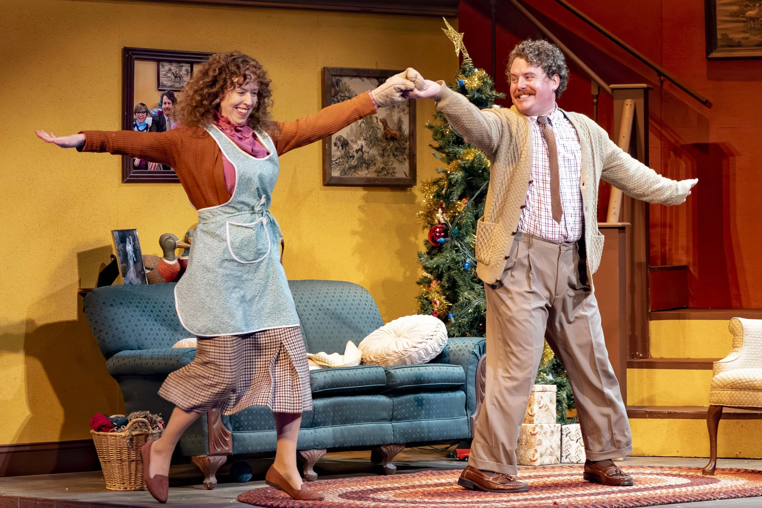 Scott Watson as The Old Man and Amanda Lea Mason as The Mother dancing together in the living room during A Christmas Story 2025 at Mill Mountain Theatre in Roanoke, Virginia. Photo by Richard Clompus.
