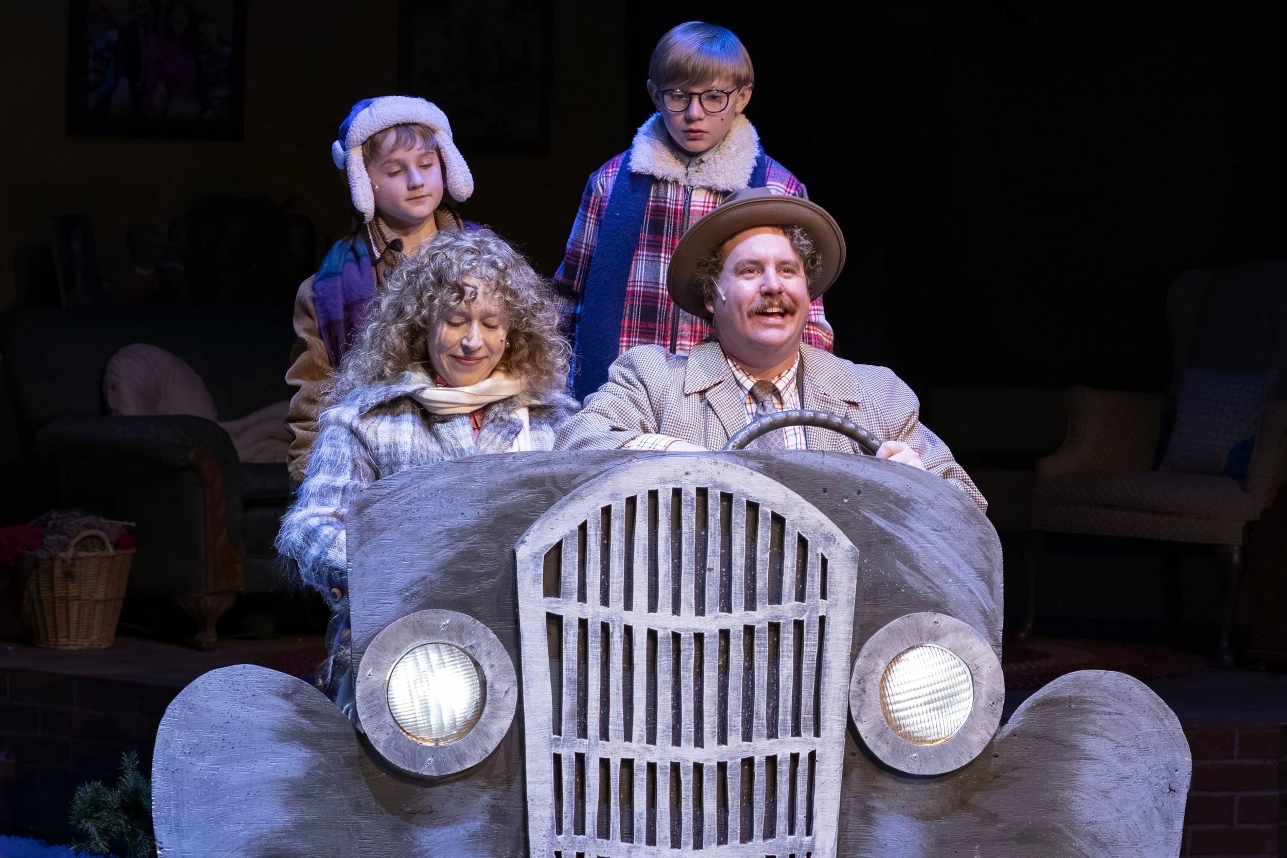 Scott Watson as The Old Man and Amanda Lea Mason as The Mother during the flat tire scene just before the infamous “Oh Fudge!” moment in A Christmas Story (2025) at Mill Mountain Theatre. Photo by Richard Clompus.