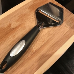 Cheese slicer doubling as a zucchini lasagna slicer.