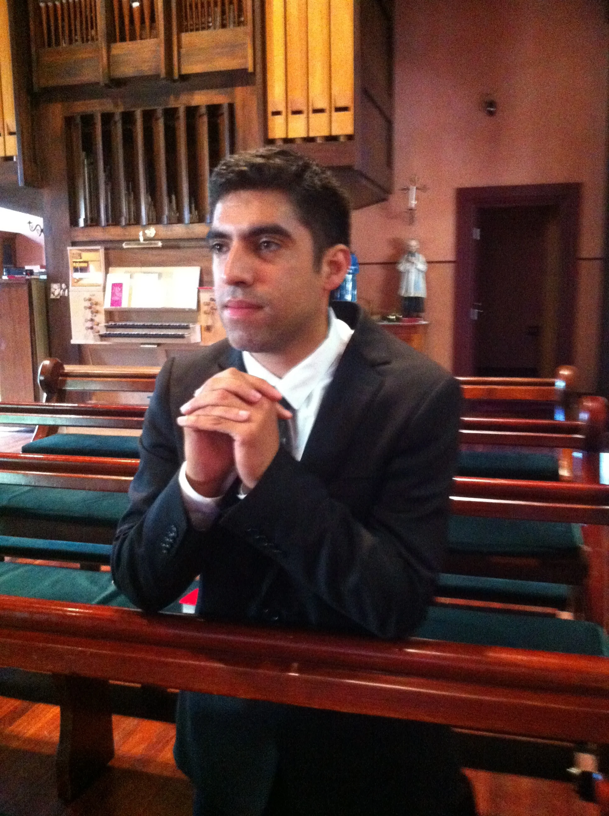 Christhian prays in the chapel at Corpus Christi College, Carlton.&nbsp;