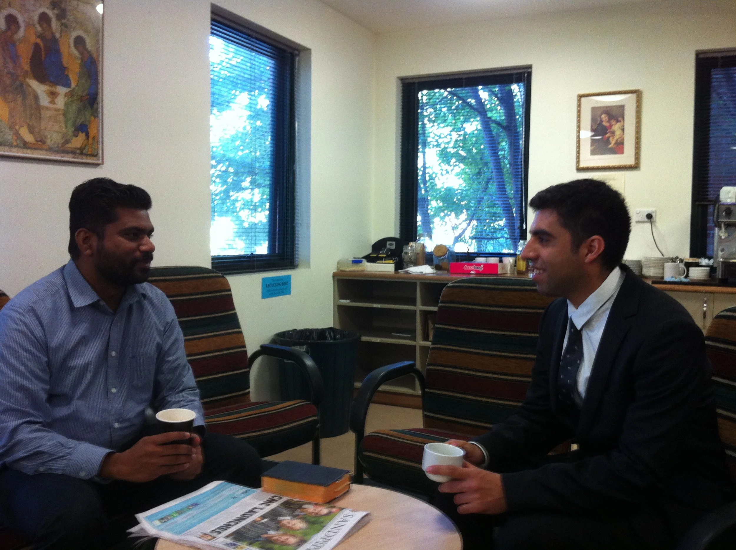 Fifth-year seminarian Vinco Muriyadan chats over coffee with Christhian at the seminary.