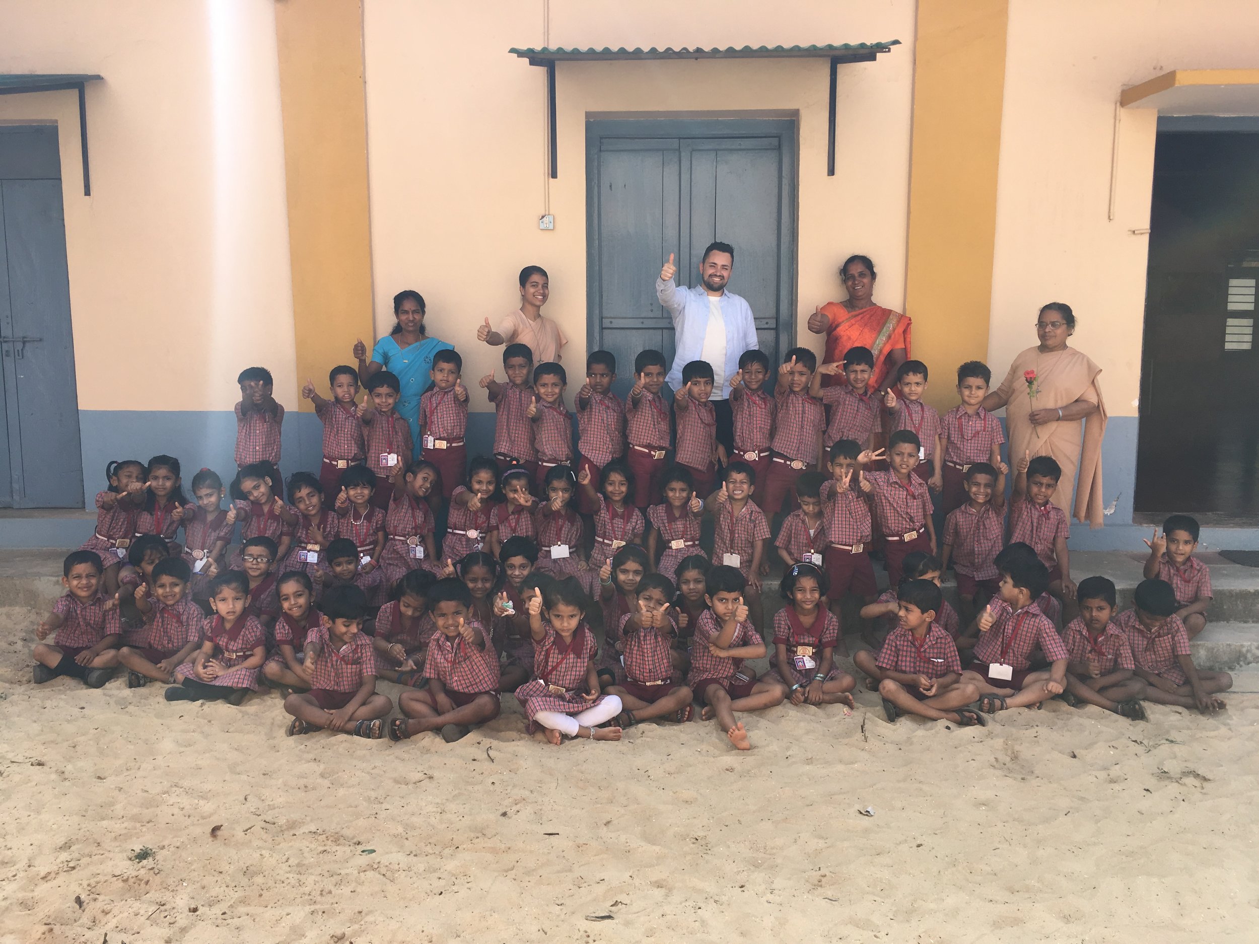 Samuel Pearson with students and teachers at the local Catholic primary school of the parish he stayed at in India.&nbsp;