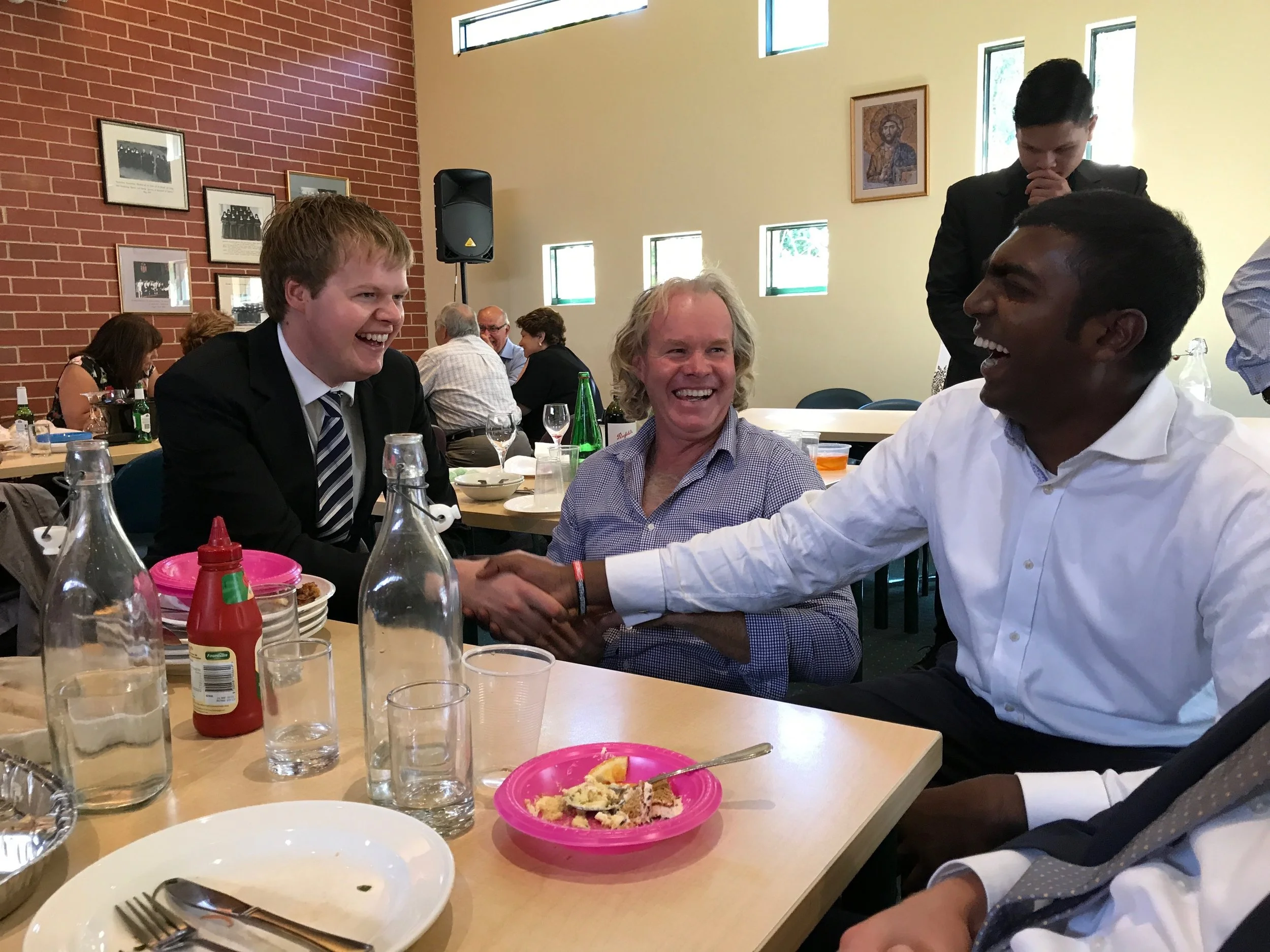 Picture, left to right: Jackson Saunders (4th year seminarian of Sandhurst Diocese) enjoys some banter over lunch with his father, Damien, and Jude Johnson (5th year seminarian of Melbourne Archdiocese) at family day.&nbsp;