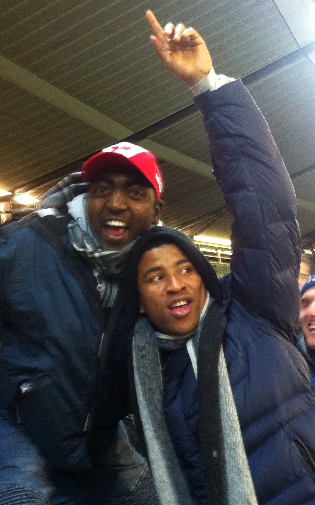 Fifth-year Melbourne student, Jude Johnson and Hobart Deacon Fidelis Udousoro celebrate a goal at the MCG in the Sydney Swans 8-point win over Hawthorn. Picture: Jackson Saunders