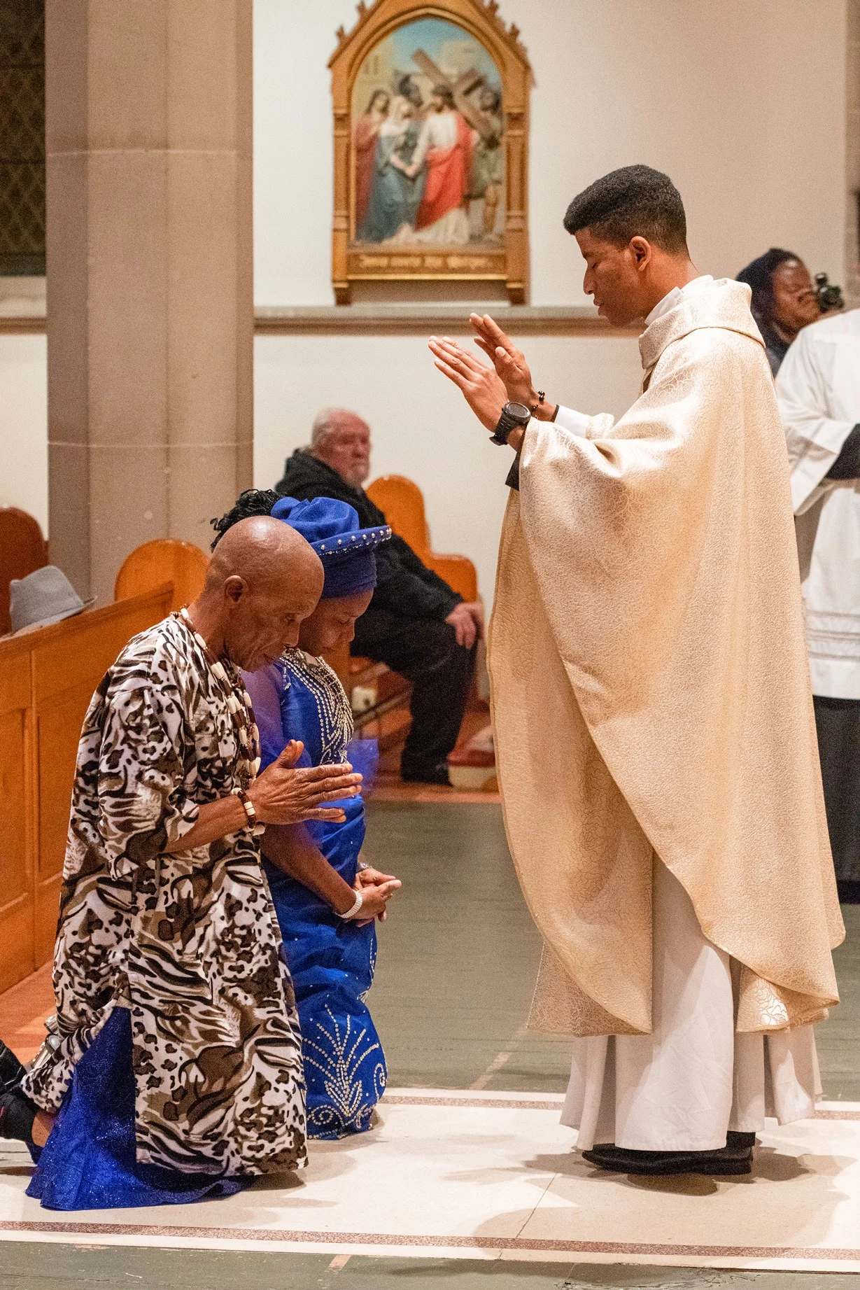 Fr Fidelis Udousoro gives his first blessing to his parents after his ordination at St Mary’s Cathedral in the Hobart Archdiocese.