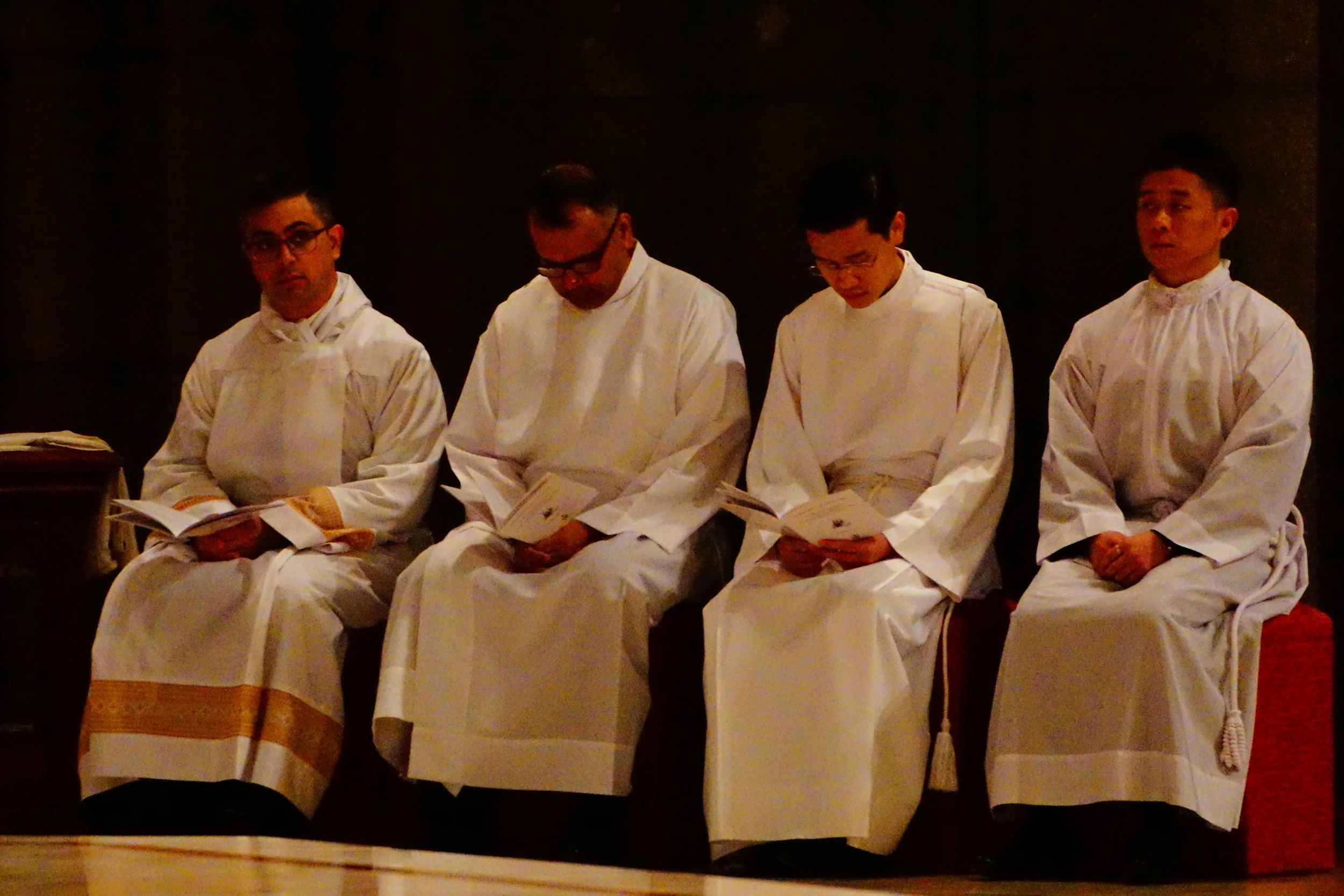 Left to right: Nathan Rawlins, Royden D’Souza, Trac Nguyen and Andrew Choi at their ordination as deacons at St Patrick’s Cathedral in East Melbourne. Picture: Joseph Nguyen.