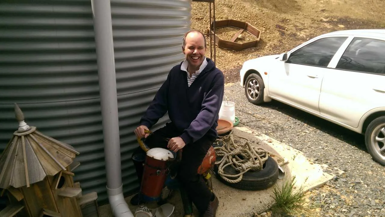 First-year formator, Fr Ed Moloney, on a model cow at the farm. Fr Ed was in his element as a former diary farmer.