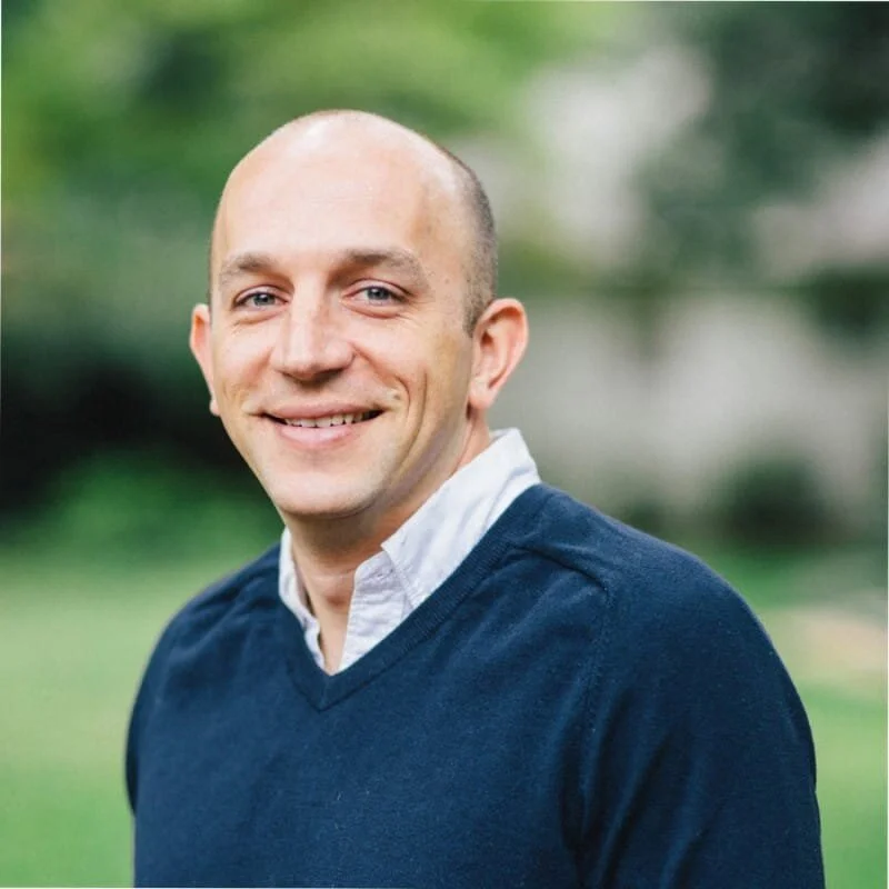 on Scott, CEO of ScopeStack, smiling man in blue sweater.