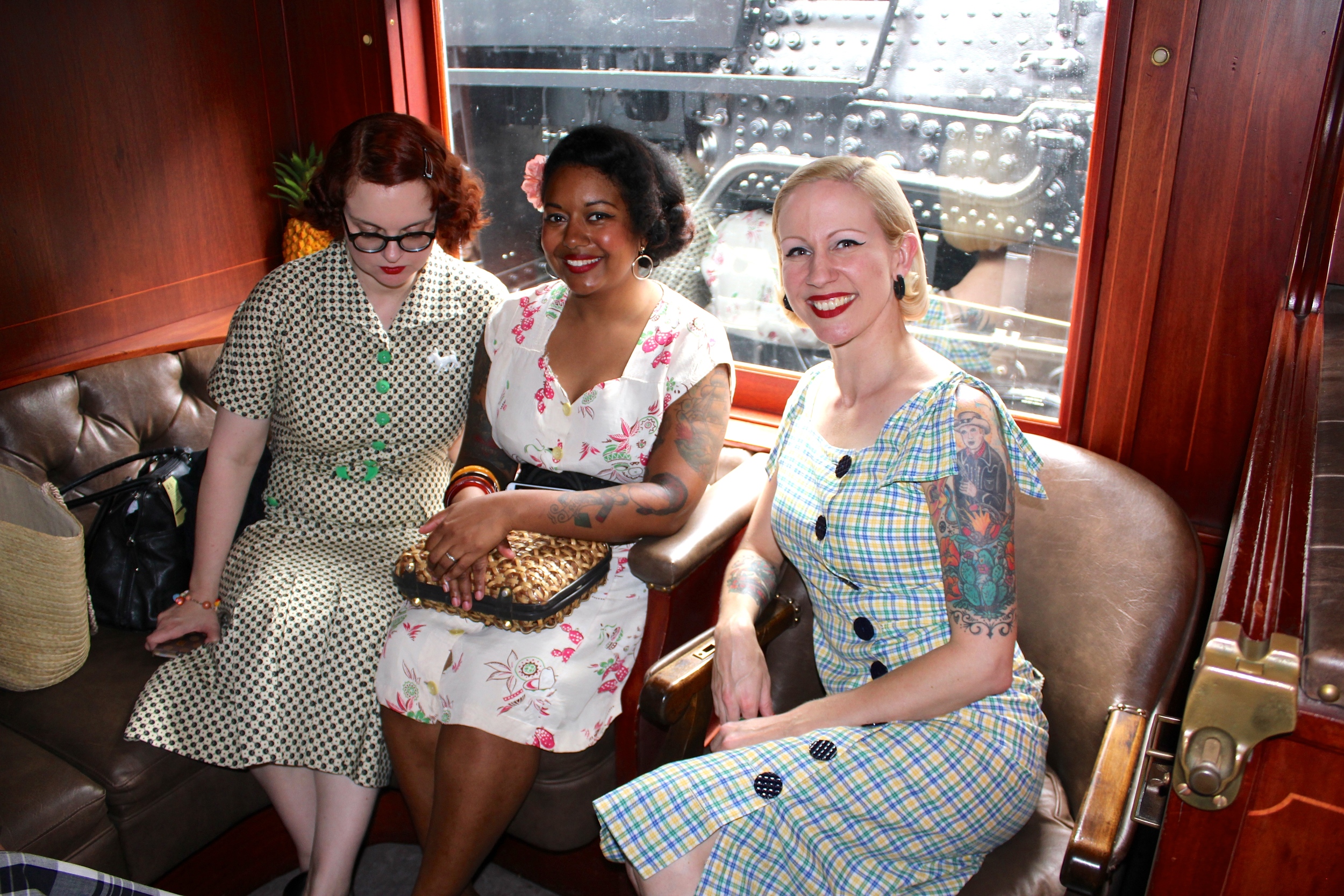 Jess, Melanie, and Elisa relaxing in their first class seats