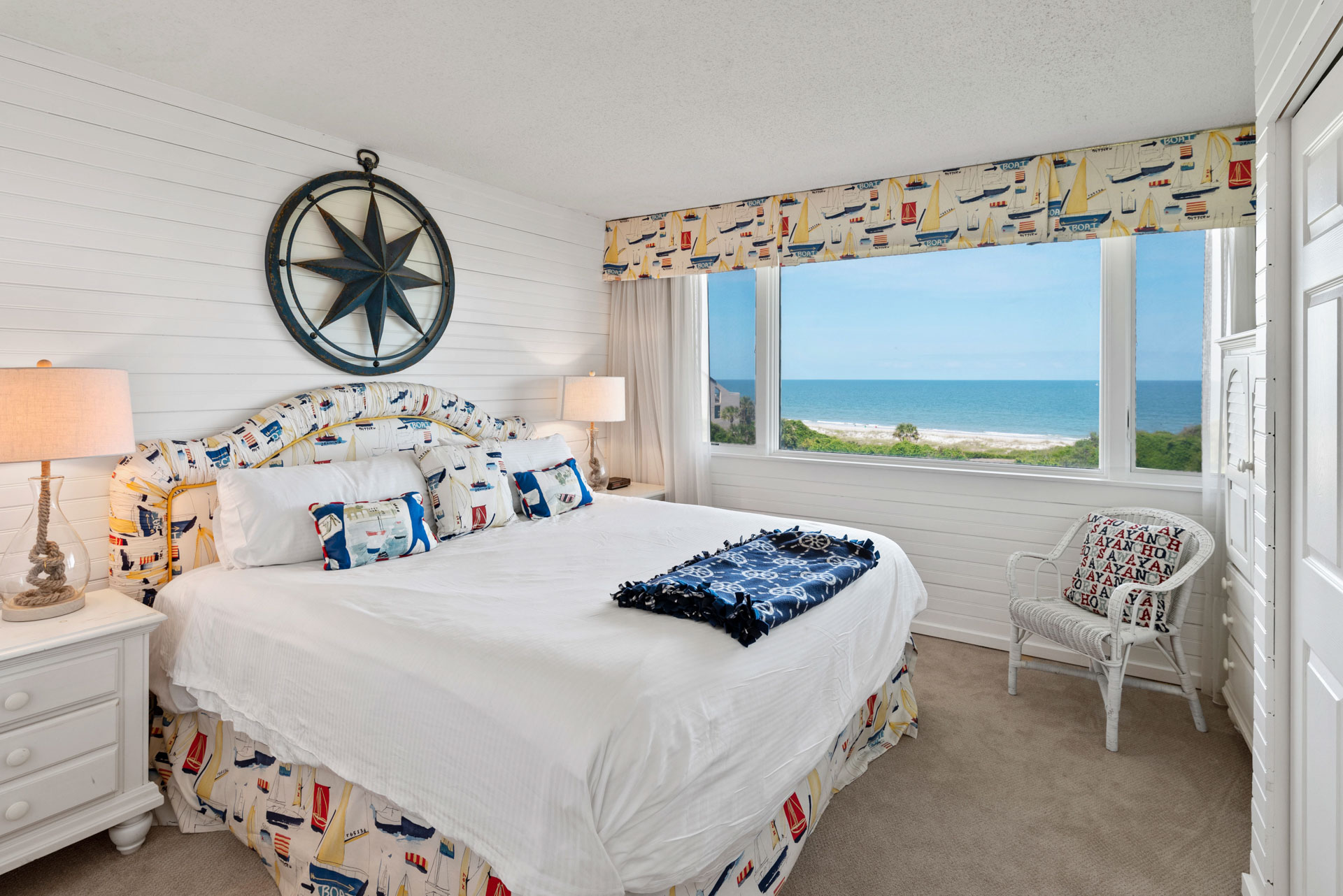 mike liddell's real estate photo of bedroom with spectacular oceanfront views