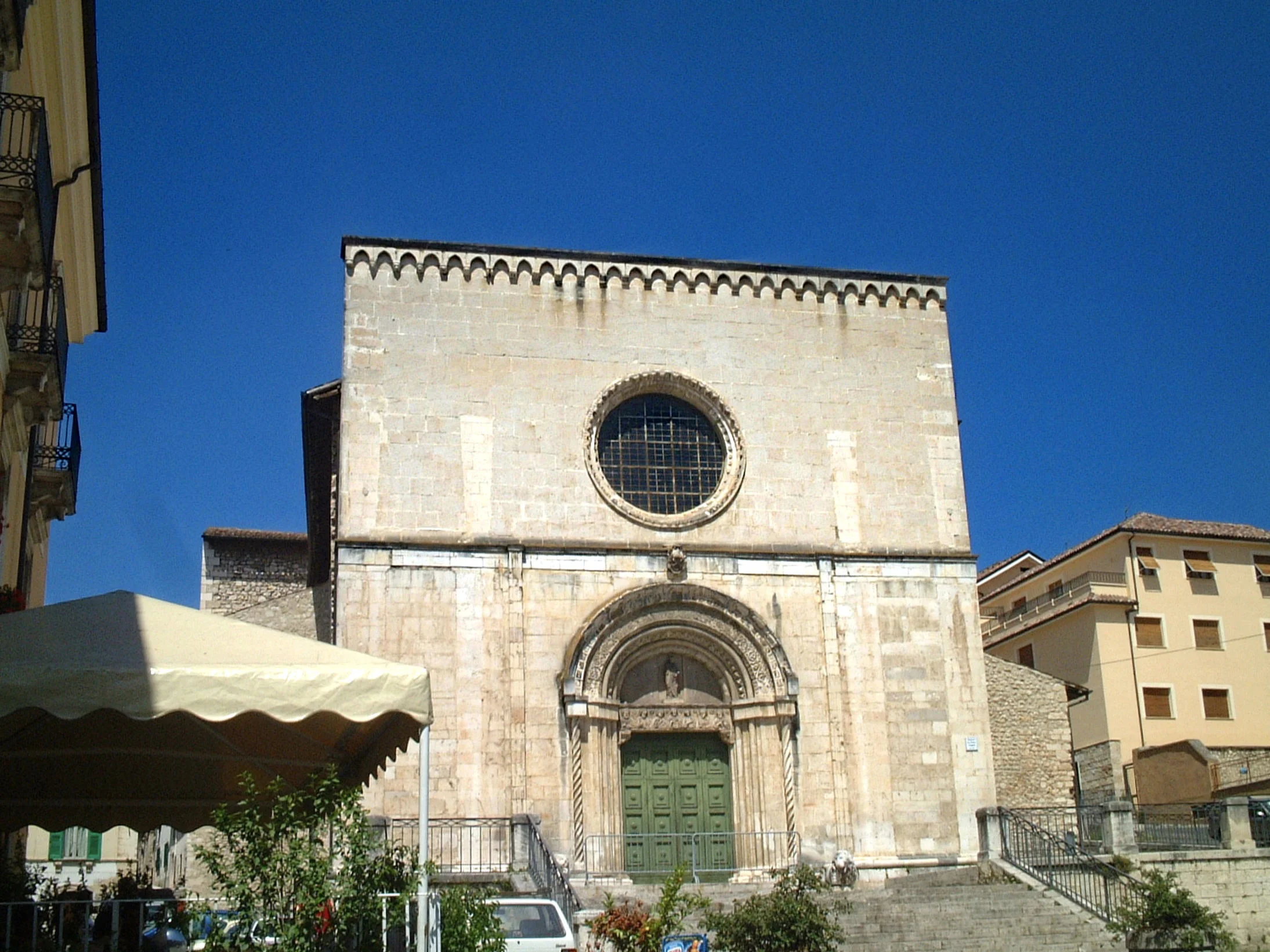 The fifteenth century church of San Pietro di Coppito in L'Aquila taken before the 2009 earthquake, with on the left the entrance to the trattoria where I had my first dinner in the city, 'La Lincosta', which remained a favourite place to spend an evening with friends and visitors. Now, alas, destroyed by the earthquake.