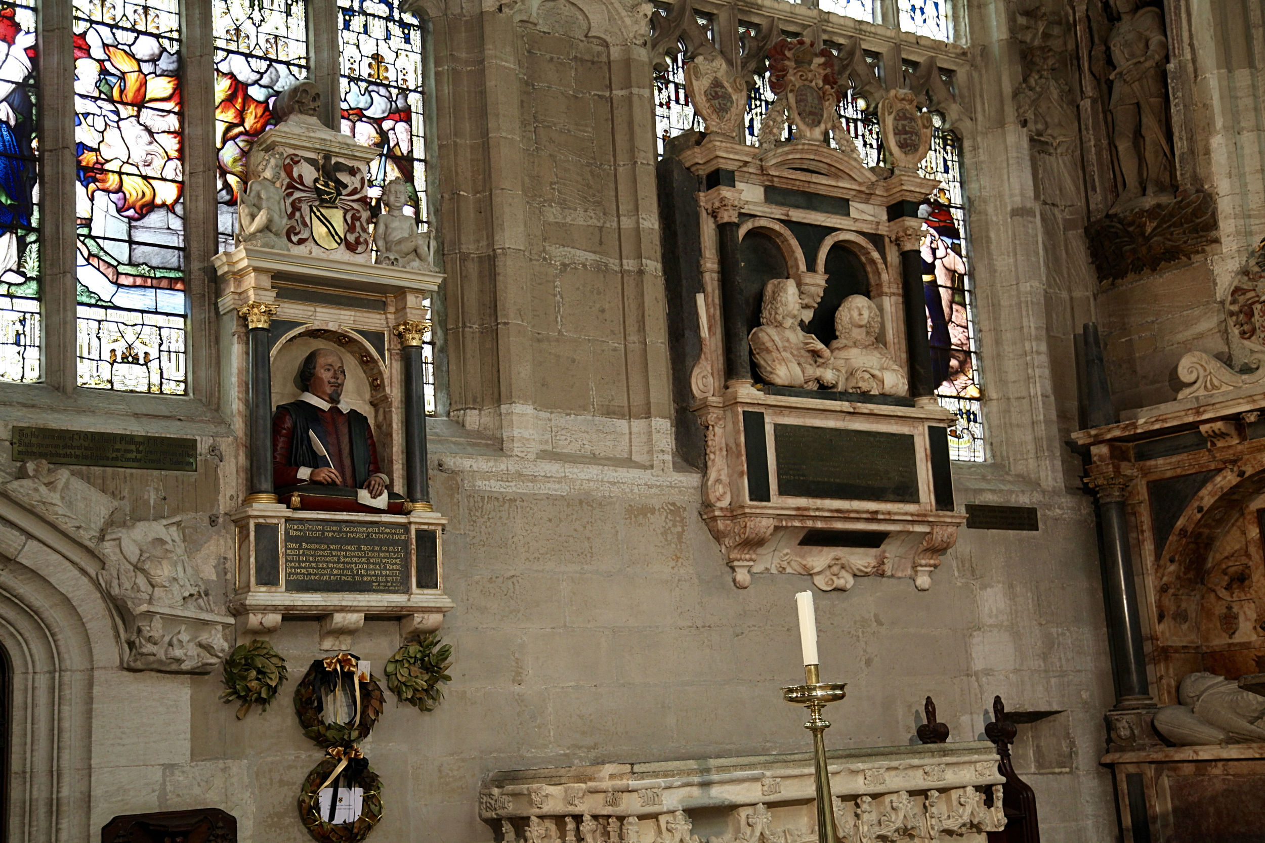 Monument above the grave showing Shakespeare with pen in hand, added a few years after his death ©Edward Burman