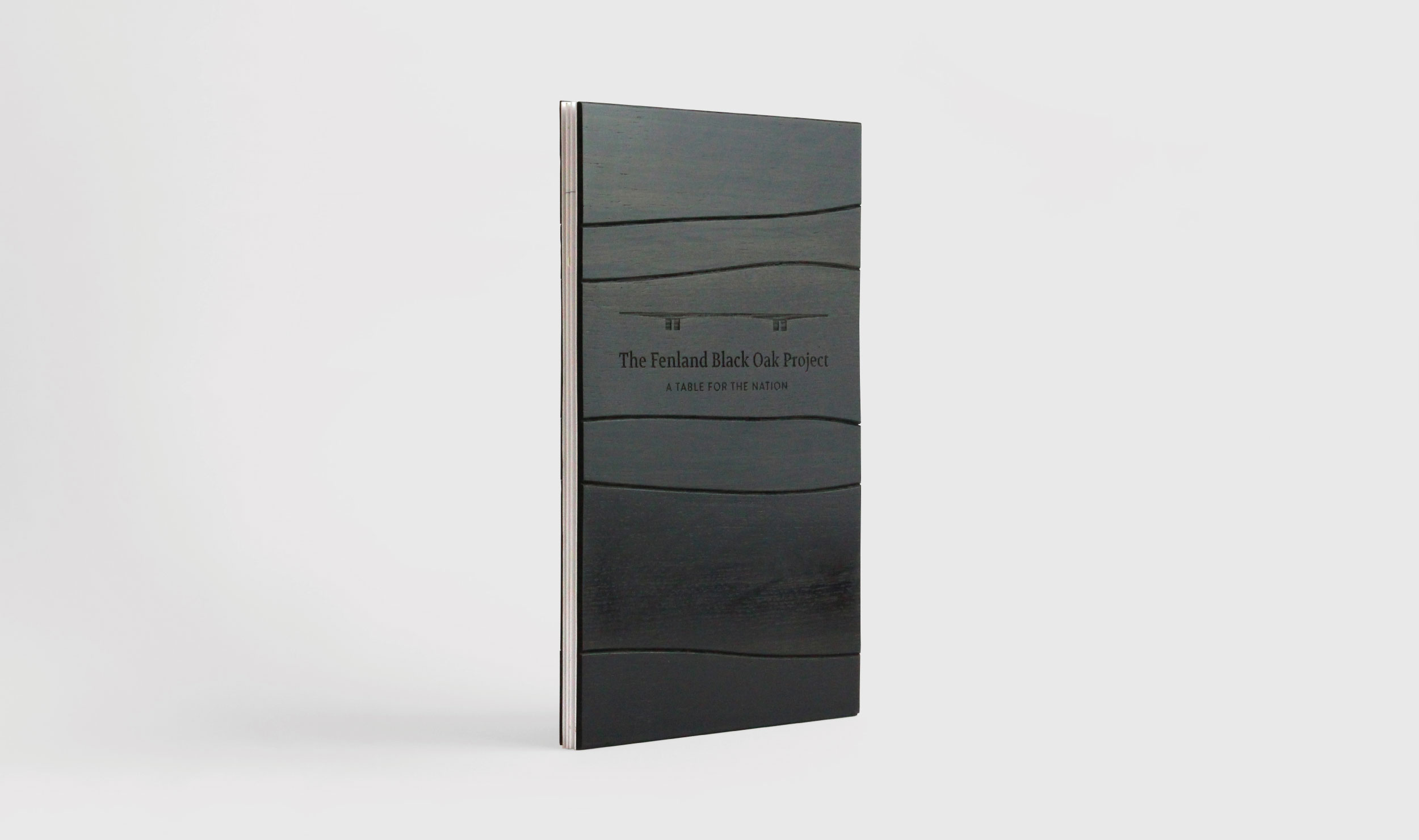 A bespoke brochure was designed for presentation to key sponsors. The covers, with their laser-etched logos, were hand assembled from different pieces of 5000 year old Black Oak.