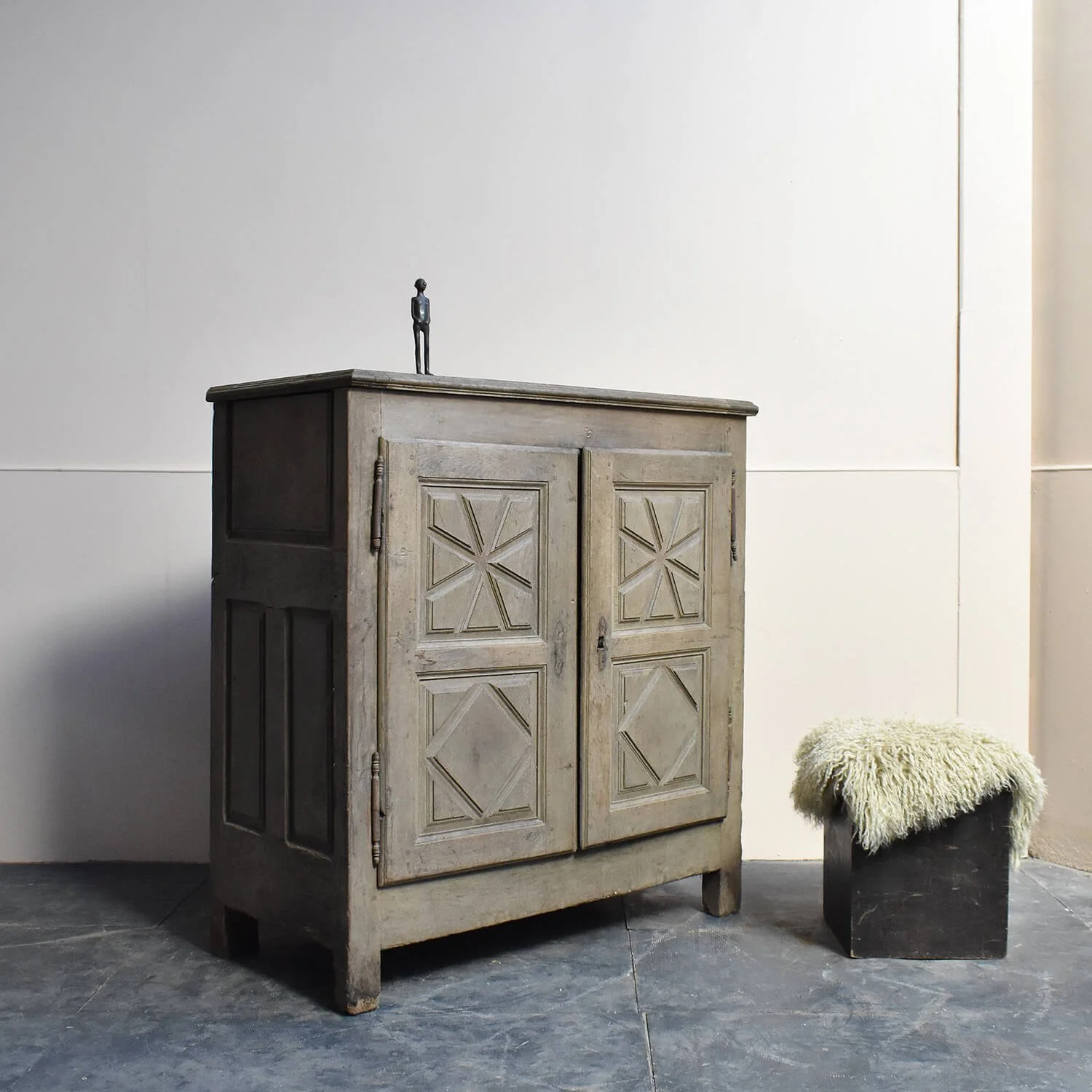 sculpture and stool with 18th Century Bleached Oak Cupboard hutt decor