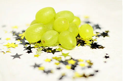 We love this Spanish tradition; eat twelve grapes when the clock strikes midnight and you will have a year of prosperity. Put twelve grapes on a skewer and soak in white wine overnight, freeze and then roll in some sugar. Hand out just before midnight and to ensure a prosperous and sweet New Year!
