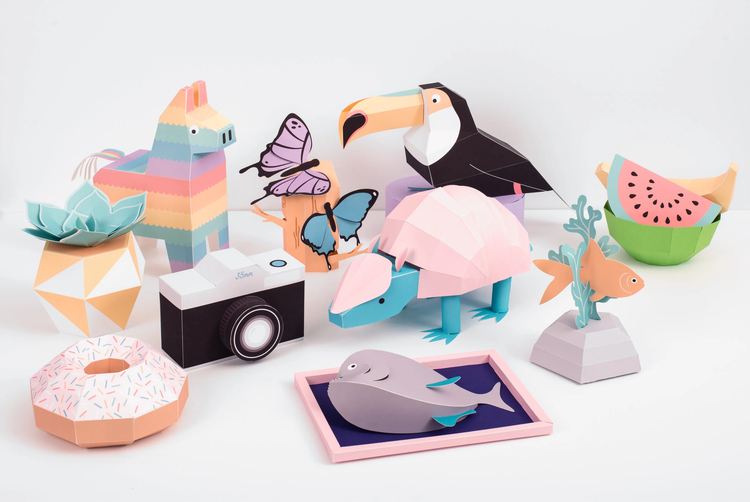  Simply pop-out, fold and stick together each of the ten super simple, super stylish 3D models, then populate your desk with them or admire on your mantelpiece. From piranhas to piñatas, this cool and quirky collection of projects makes a gorgeous gi