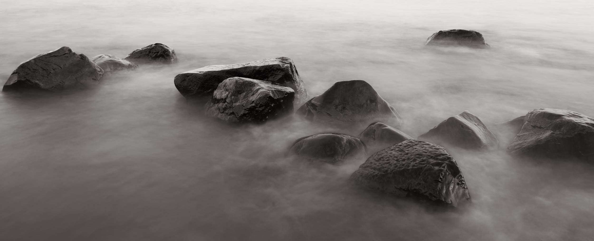 I love the rocks that sit along the shore of Little Presque Isle. Its fun to study them and notice the shapes, line, structure, wrinkles, pores, expression of each one. Michigan Landscape Photography.