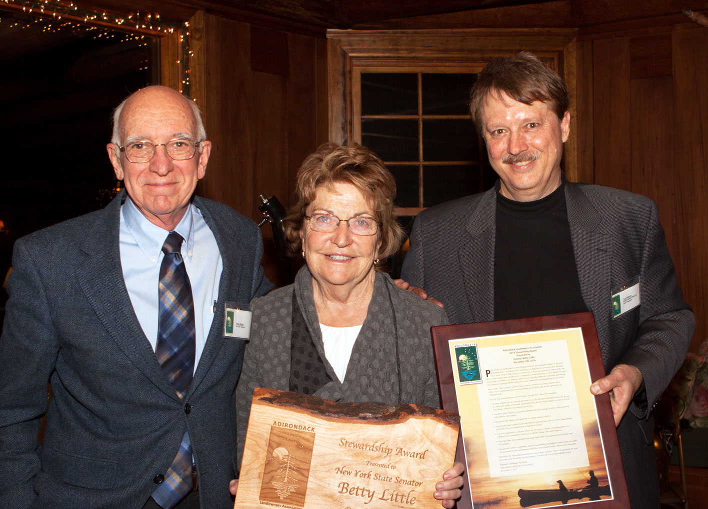 Senior Advisor Ross Whaley and President Tom Williams present the 2014 Stewardship Award to Senator Betty Little. 