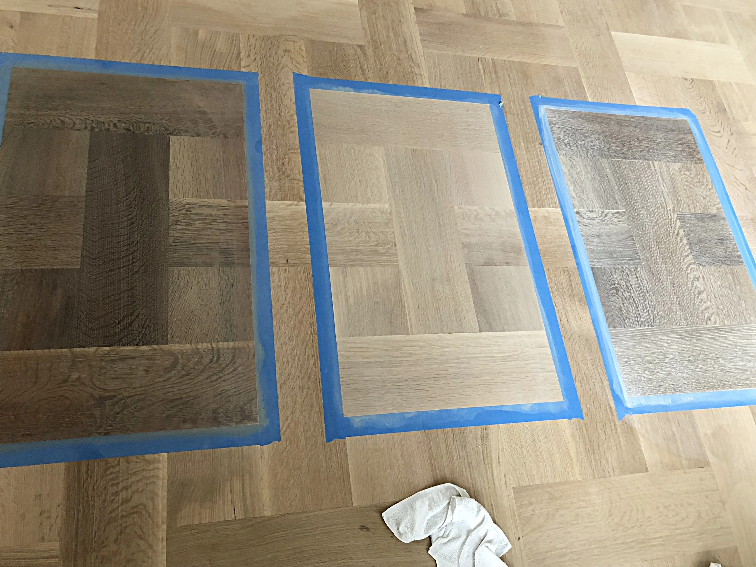 Asharoken, NY: Making WOCA Samples on 8" Rift and Quarter Sawn White Oak flooring, basketweave pattern. Samples from left to right are: Woca Softwood Lye, Woca Pre-Color White, Woca Driftwood Lye White, all with Woca Color Oil Extra White. 