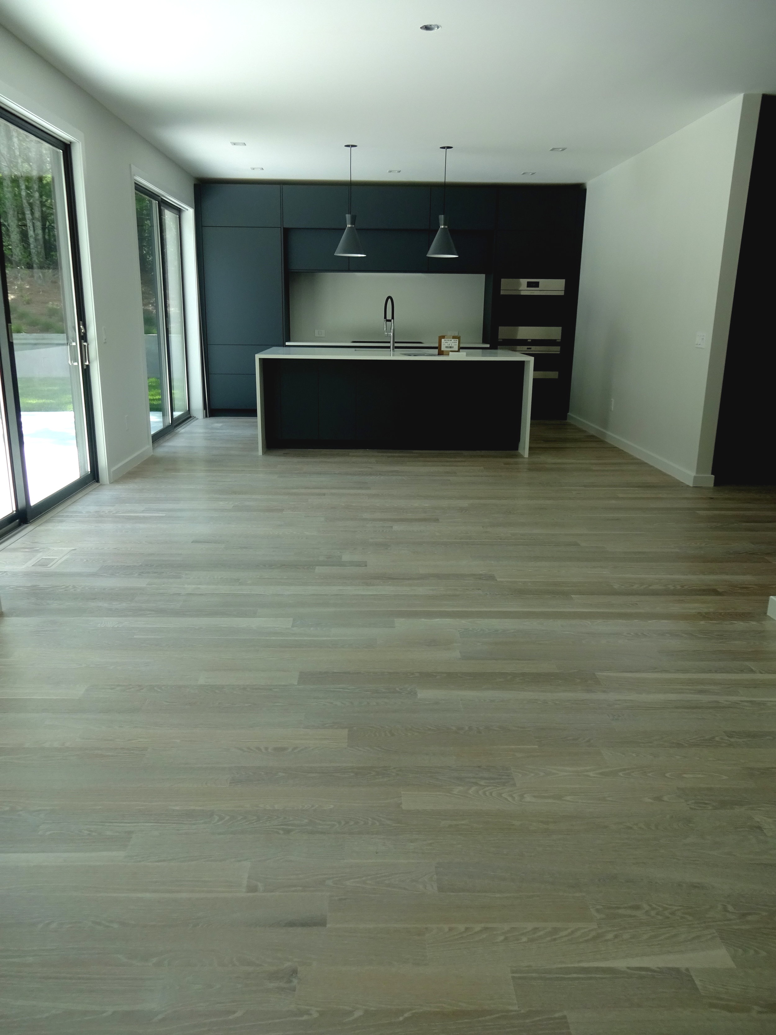 SAG HARBOR WOCA GRAY FLOORS + NAVY KITCHEN