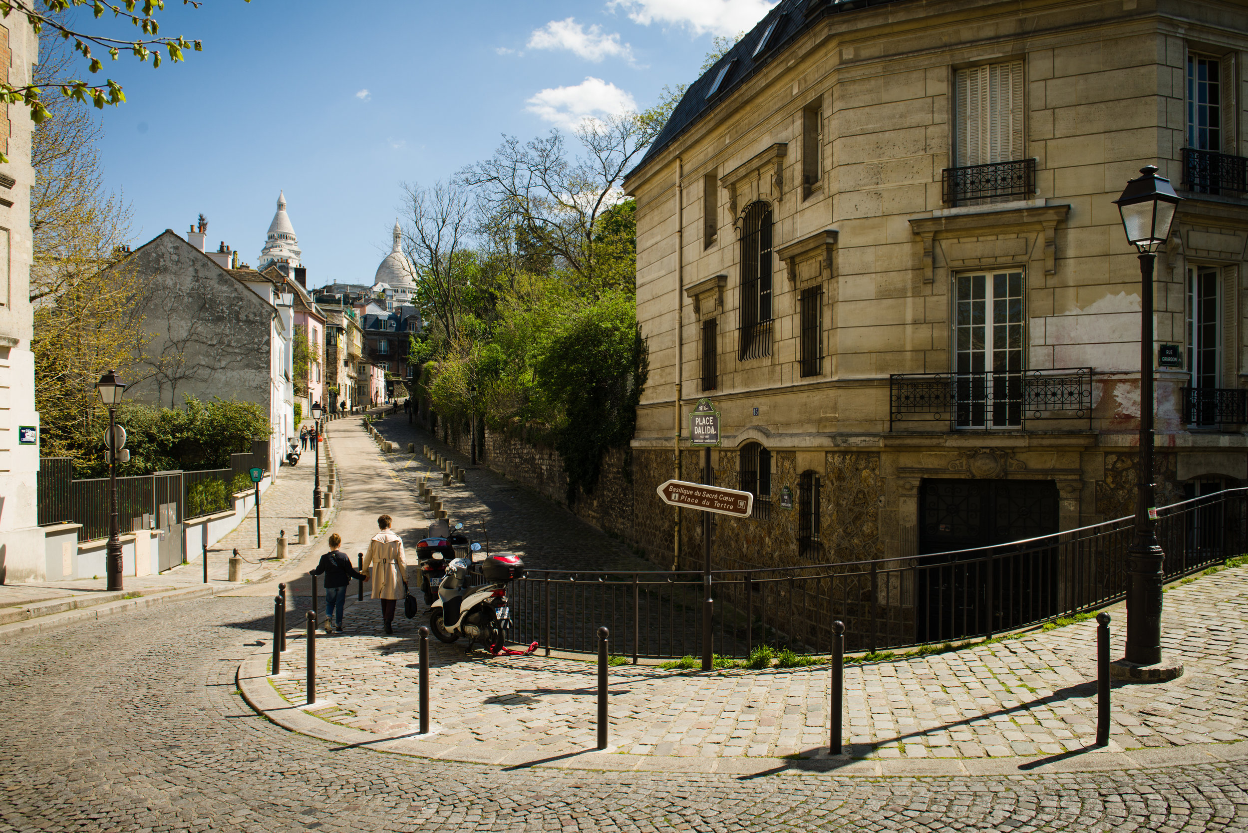The street acts as a leading line pulling your eye to the Sacré-Coeur in the distance. Photo by William Lounsbury.