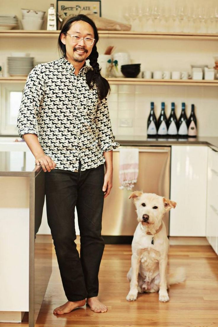 Joe Kwon and Buckley in Joe’s dream kitchen designed by The Raleigh Architecture Co. Photo by Juli Leonard