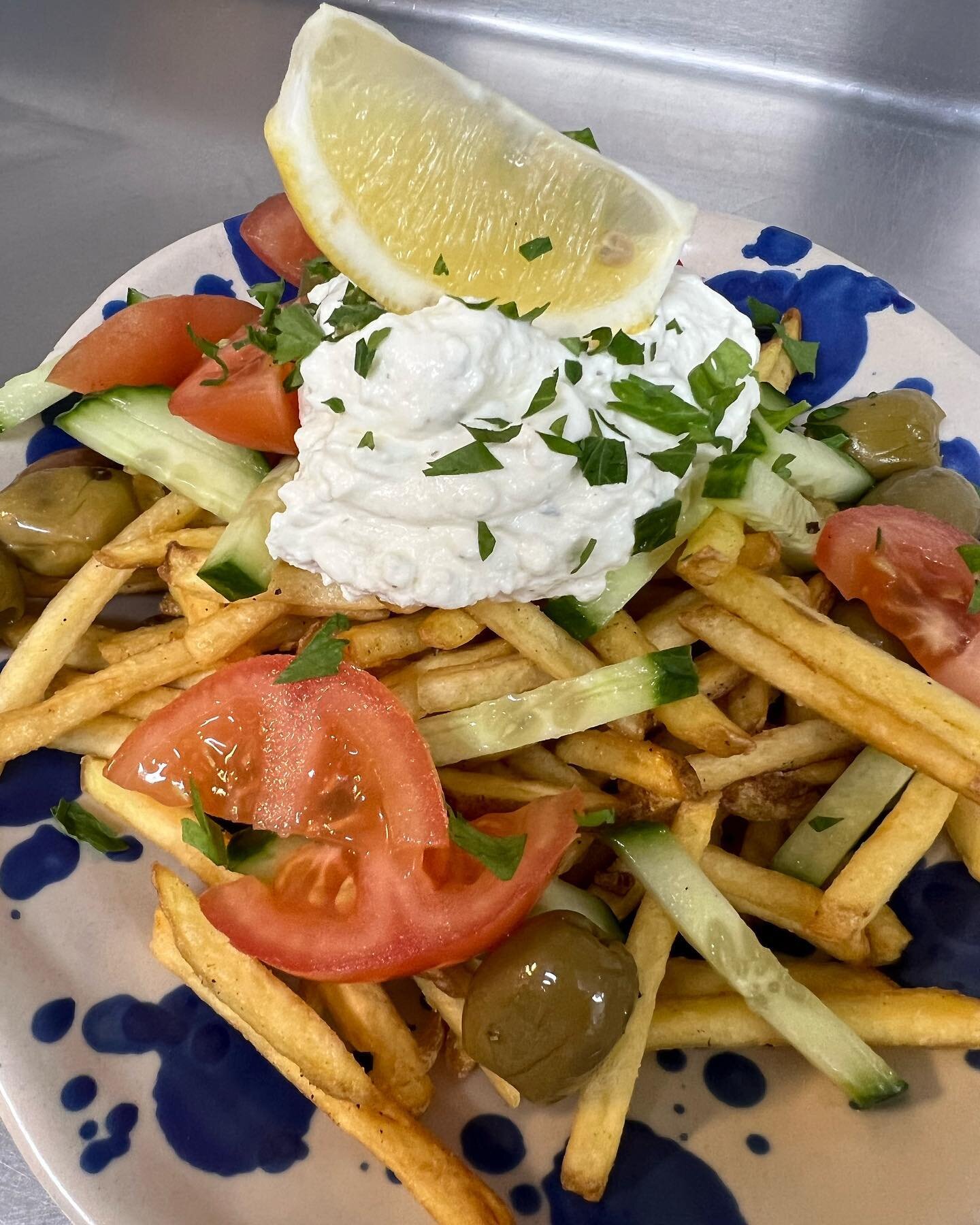 Greek loaded fries! Whipped feta,  tomatoes, cucumber and olives with crispy fries, perfect for a sunny Sunday. Open until 4 today #beachfood #beachcafe #walescoast #llangrannog