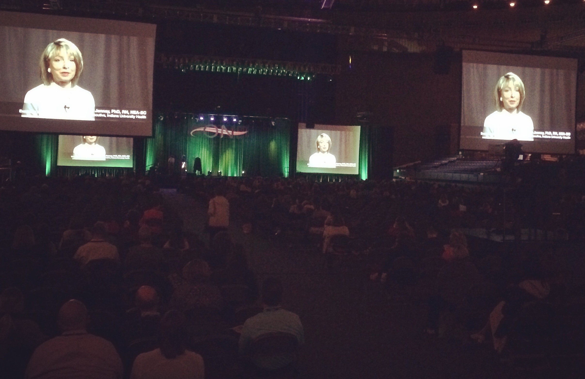 A video we filmed and edited onsite plays on the big screens