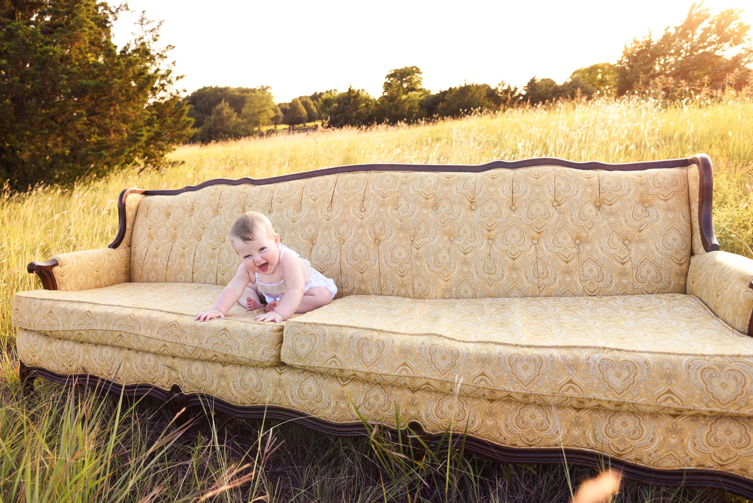 baby laughing on couch.jpg