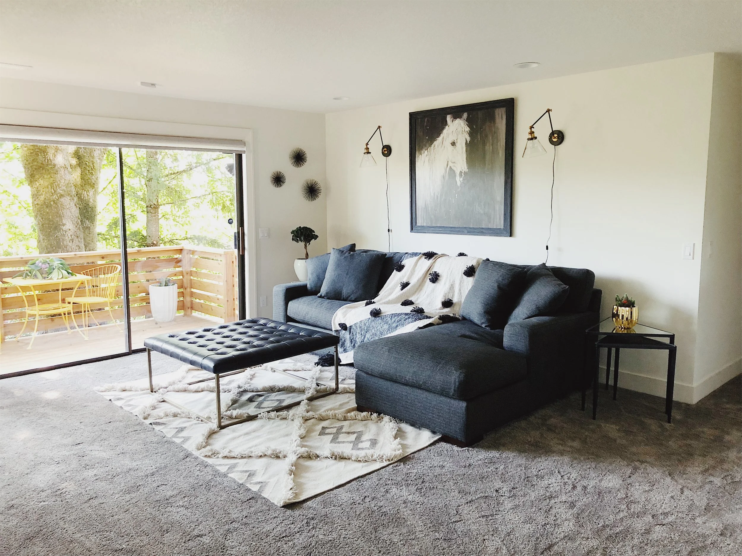 AFTER // Very soft cozy new carpet, fresh new paint, comfy dark sofa from Z Gallery. Coffee Table from World Market.