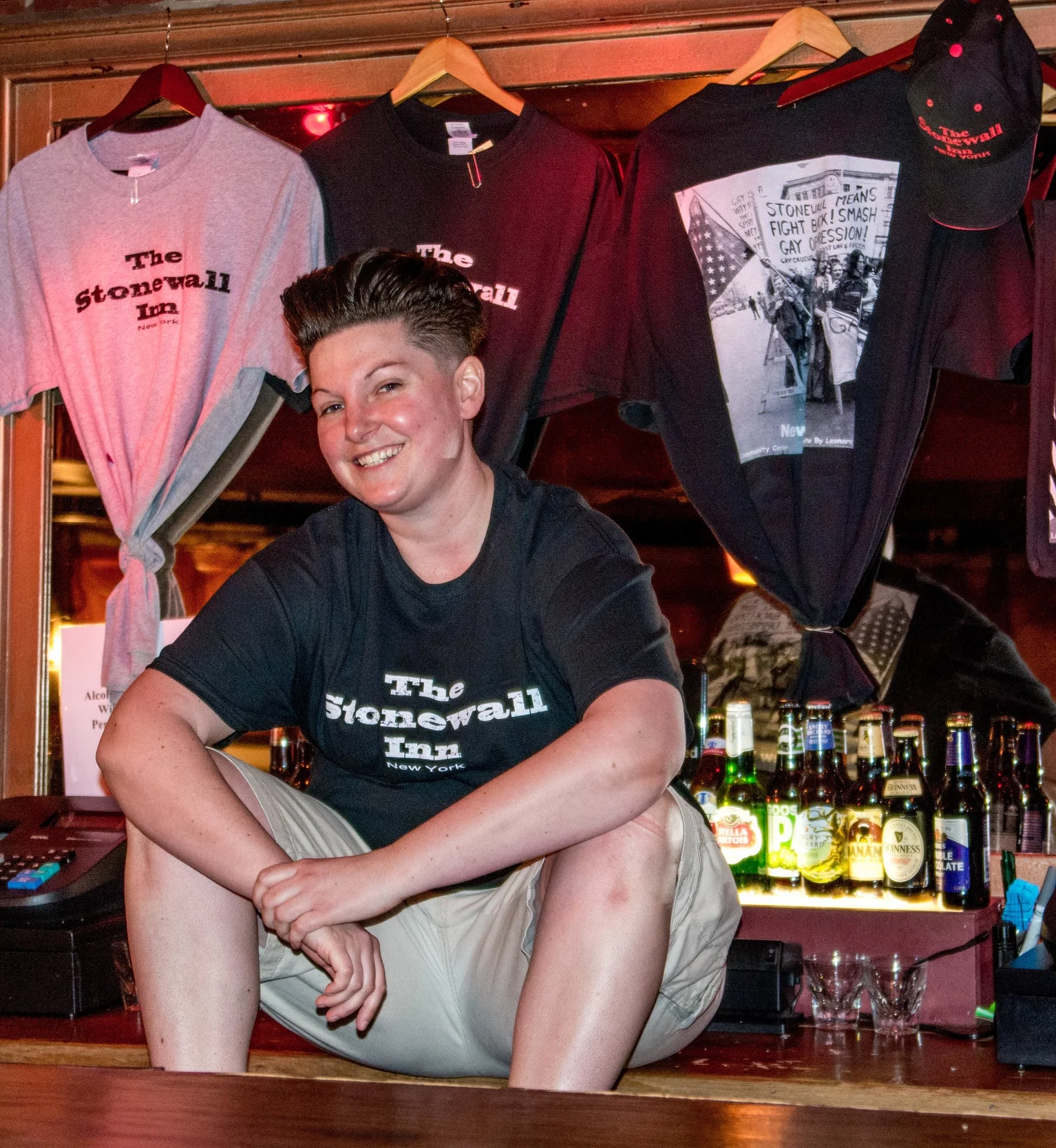 Holly Nickname: Hollabeck Hometown: Malden, MA While I’ve called all five boroughs home, I’m still a Boston native and love my Beantown teams! After years of bartending. Dj-ing, and working odd jobs on film sets, I’ve found a second home at the Stonewall Inn. People say that I’m always laughing with a smile on my face! While the Stonewall Inn keeps me very busy, I also have a career as a NYC real estate agent. Need an apartment? Don’t hesitate to call! Works: You may see her at any time- drop in and you are sure to find her!