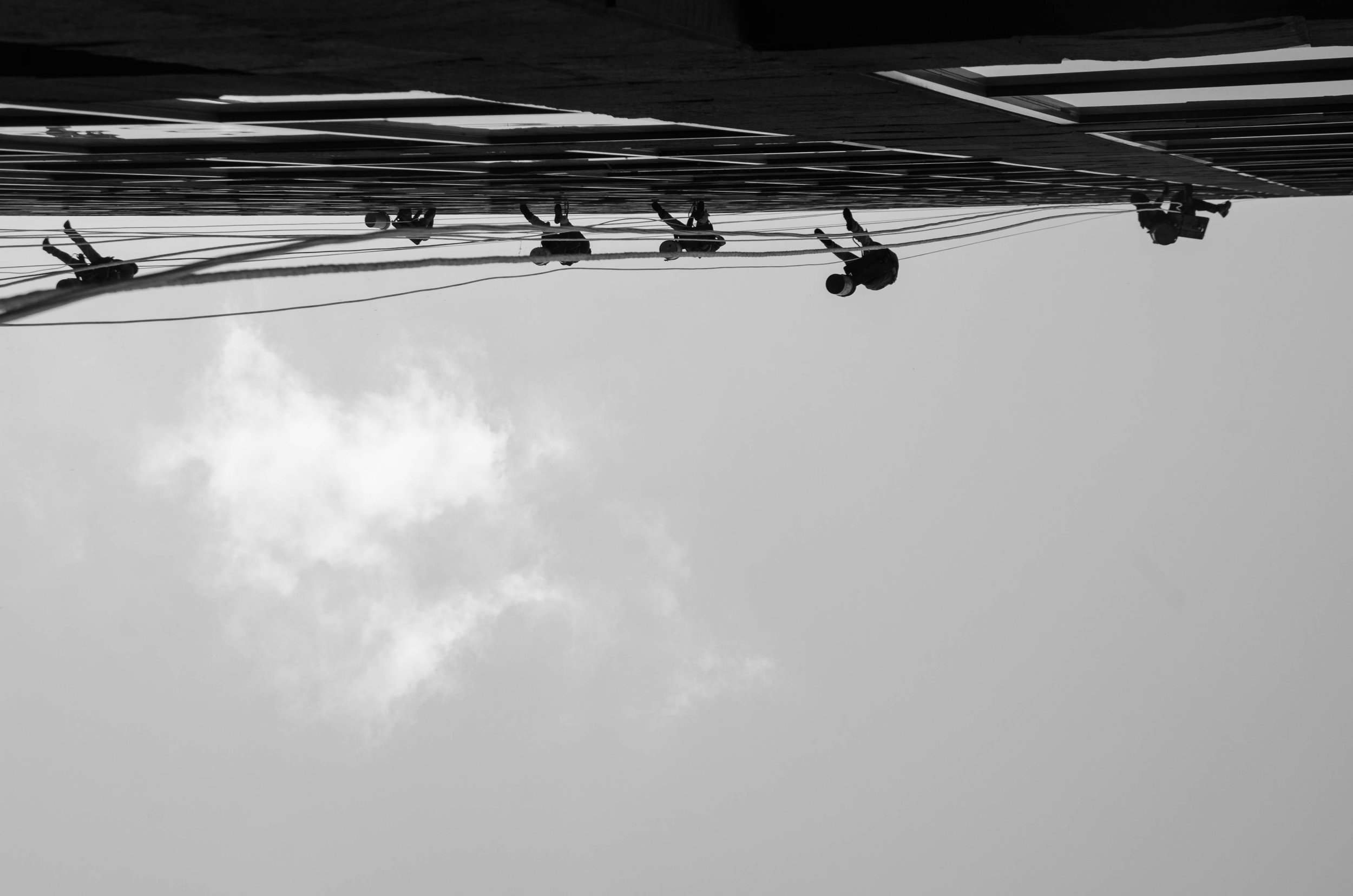 Window washers make their way up a skyscraper in Dallas, Texas.